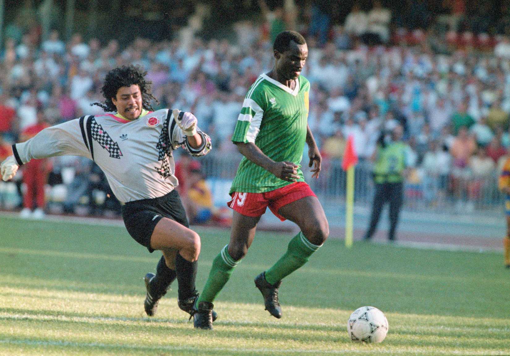 Higuita charges down Roger Milla to try and correct a mistake