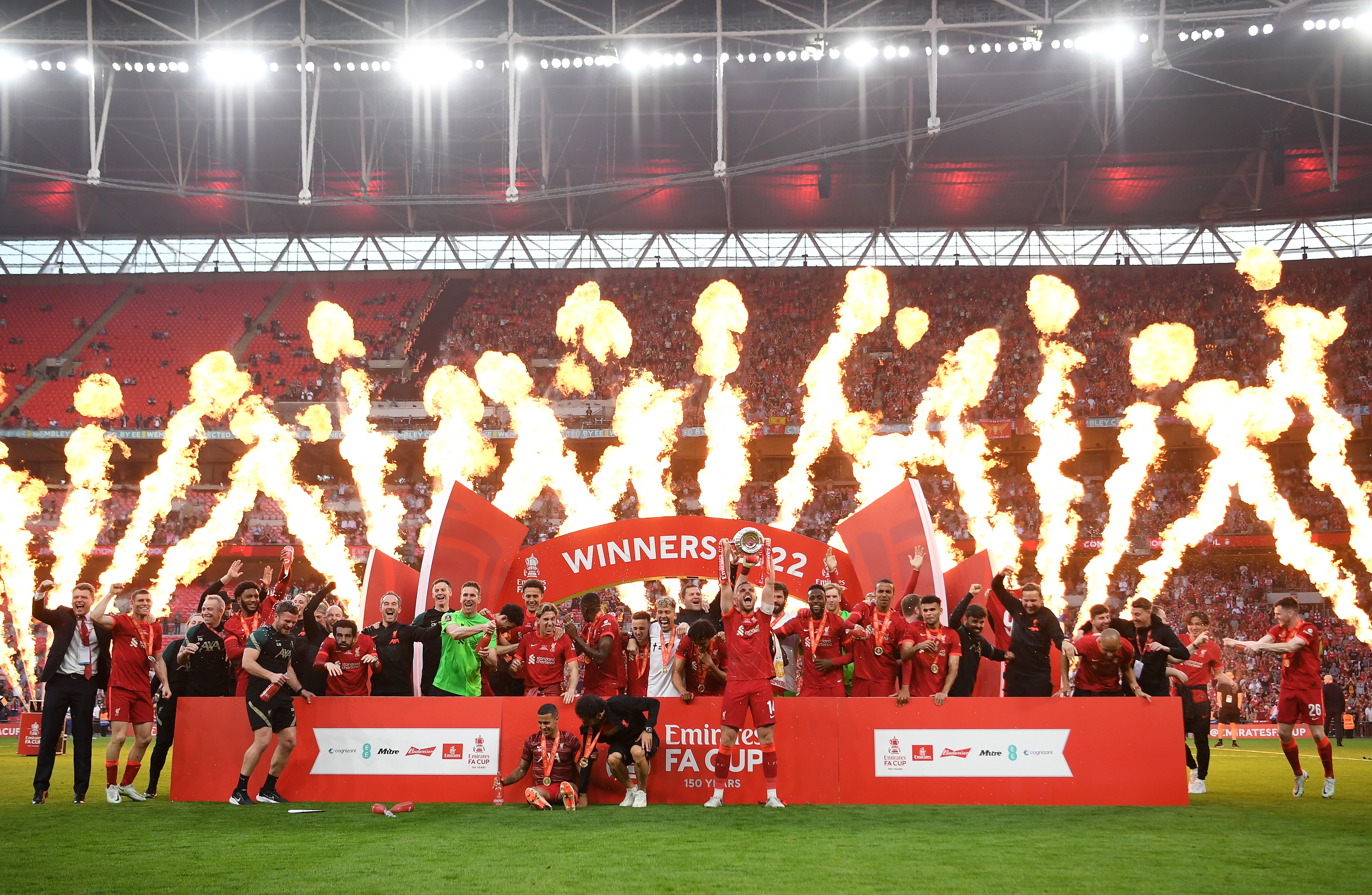 Jordan Henderson of Liverpool lifts The Emirates FA Cup trophy after their sides victory during The FA Cup Final match between Chelsea and Liverpool at Wembley Stadium on May 14, 2022 in London, England. (Photo by Shaun Botterill/Getty Images)