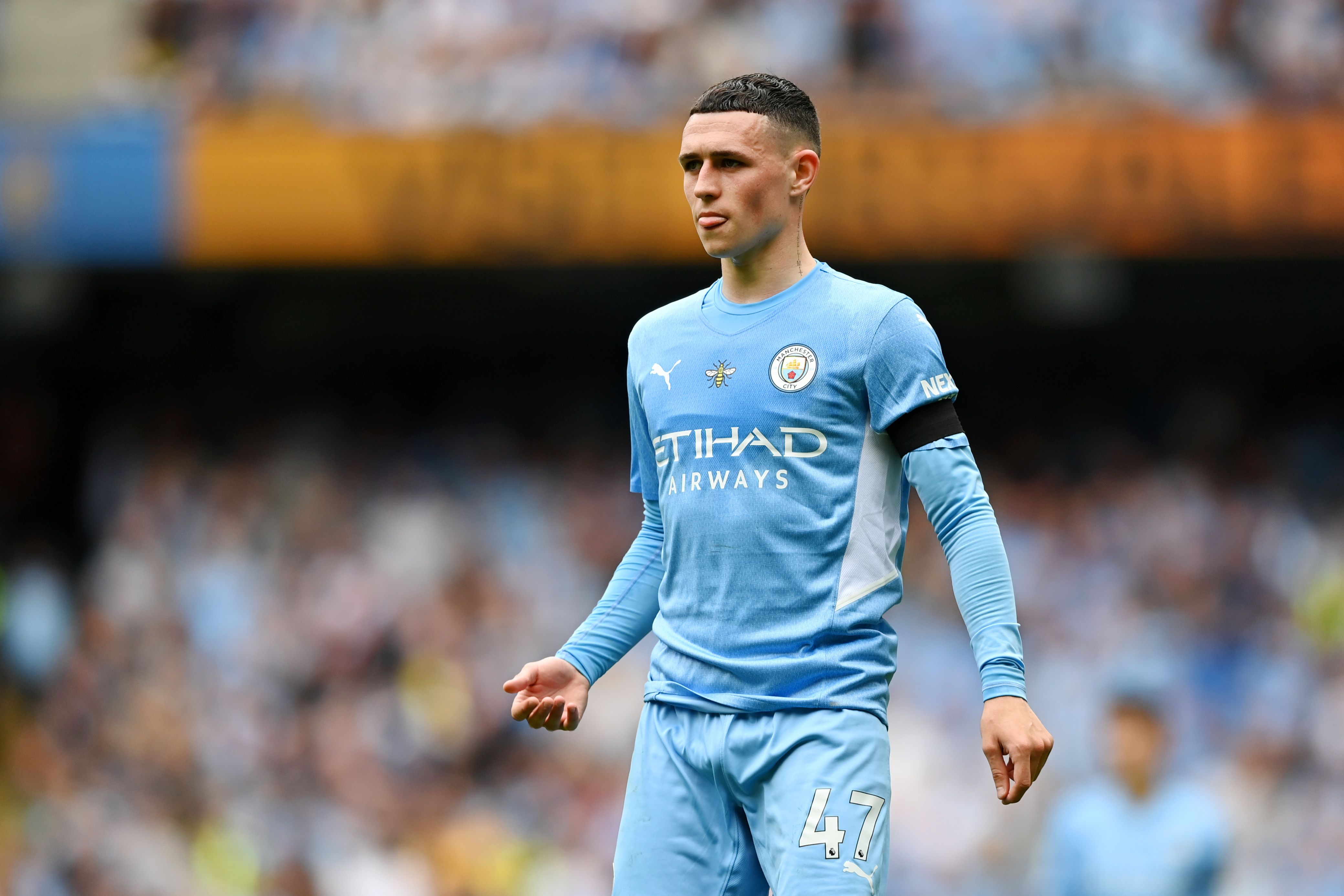 Foden looks on for the ball for Manchester City