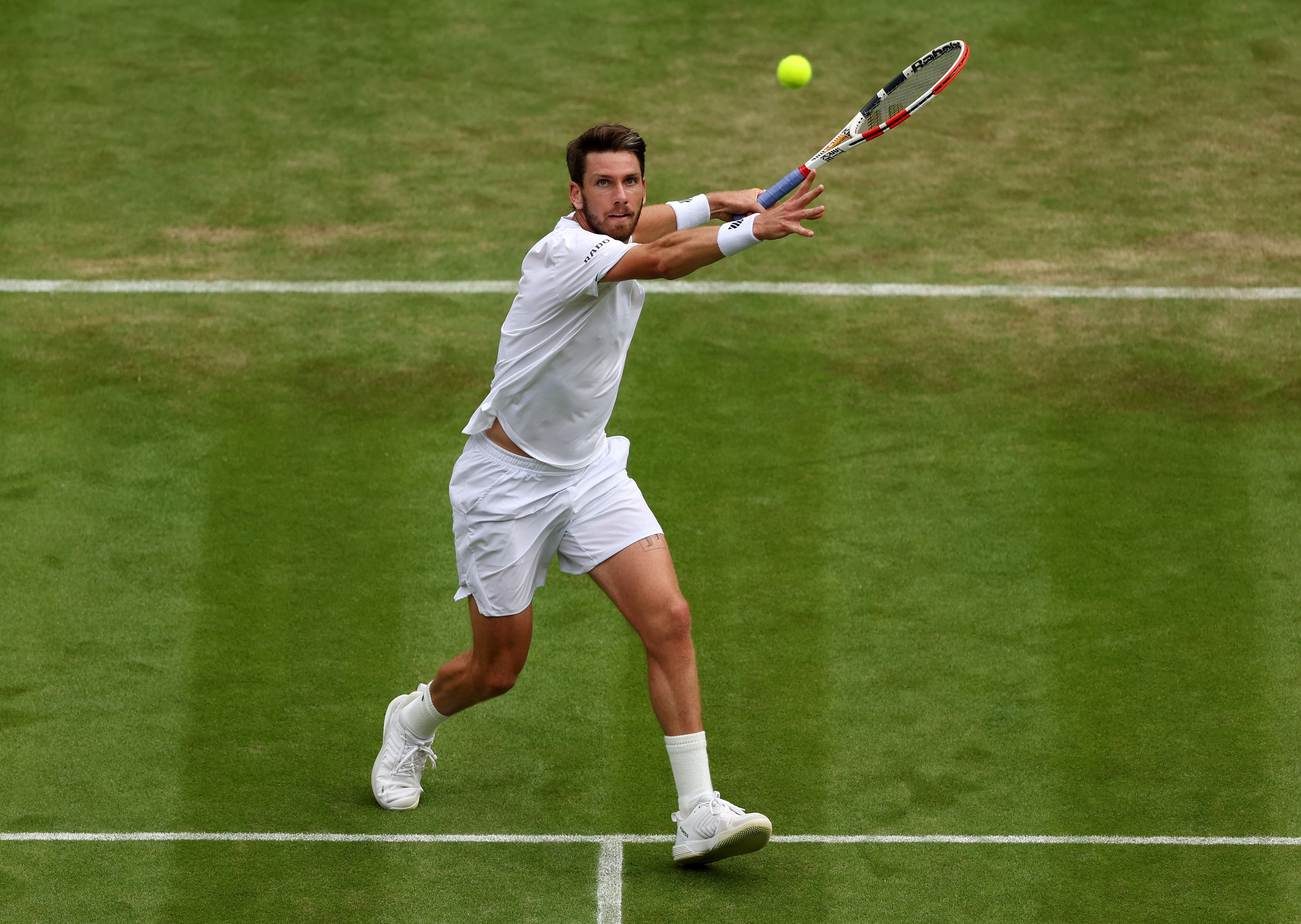 Cameron Norrie of Great Britain plays a forehand against Jaume Munar of Spain during their Men's Singles Second Round match on day three of The Championships Wimbledon 2022 at All England Lawn Tennis and Croquet Club on June 29, 2022 in London, England.