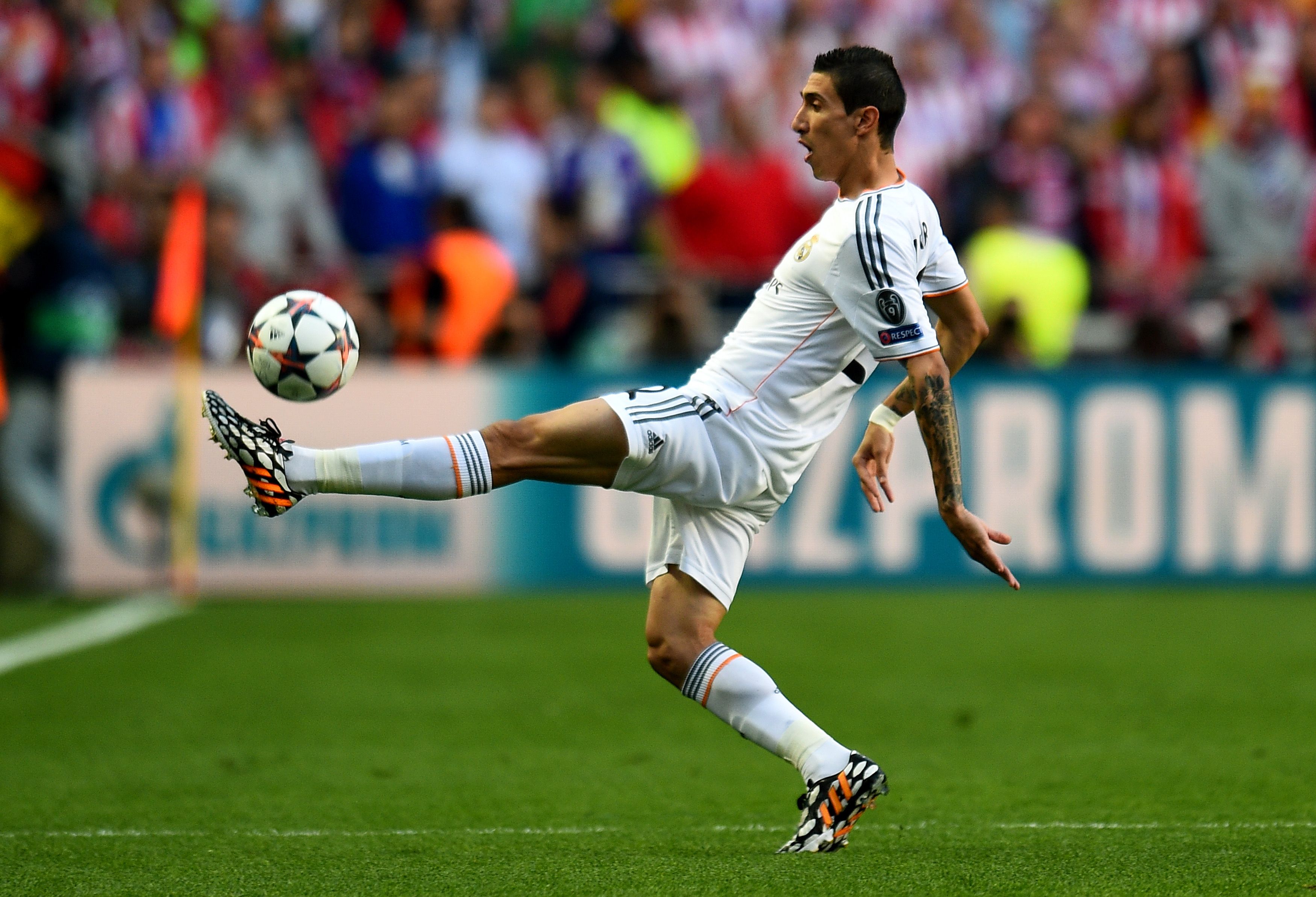 Di Maria brings a ball down with his left foot