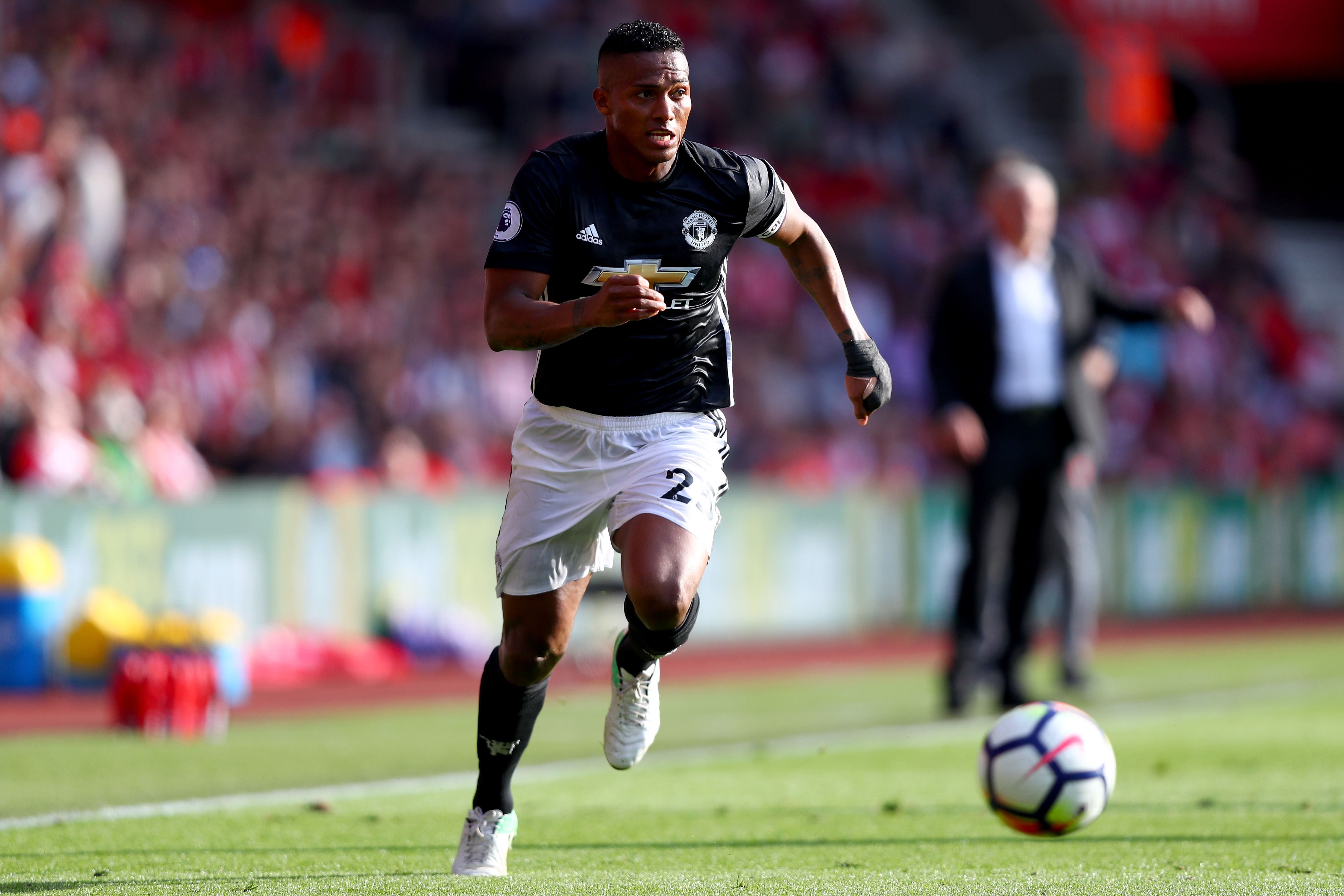 Valencia takes the ball down the right flank for Manchester United