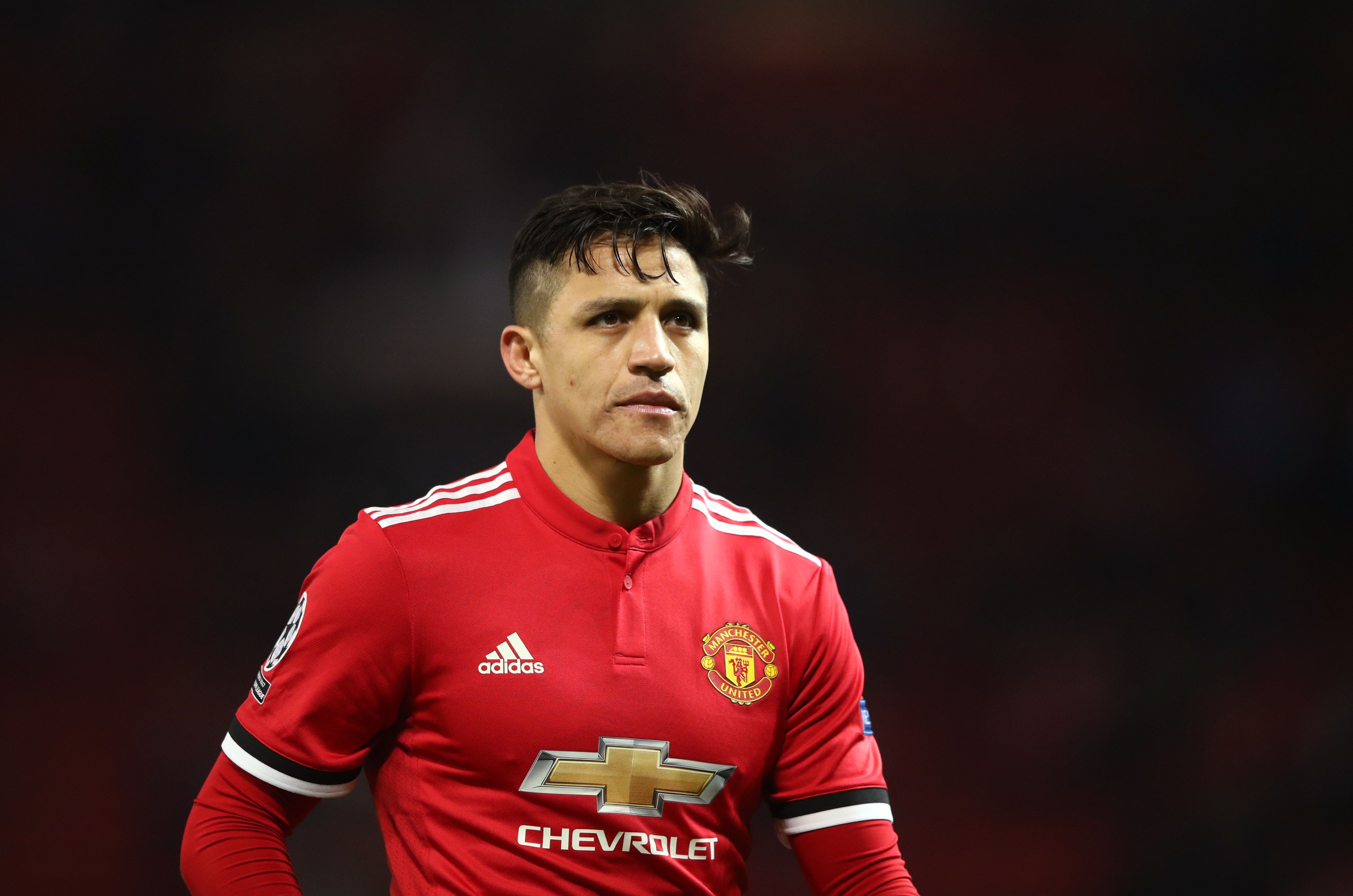 Alexis Sanchez looks disappointed while playing for Man United