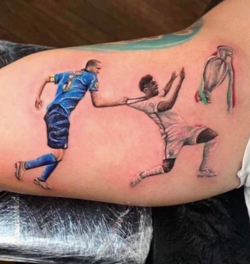 Italy fan's tattoo of Chiellini vs Saka