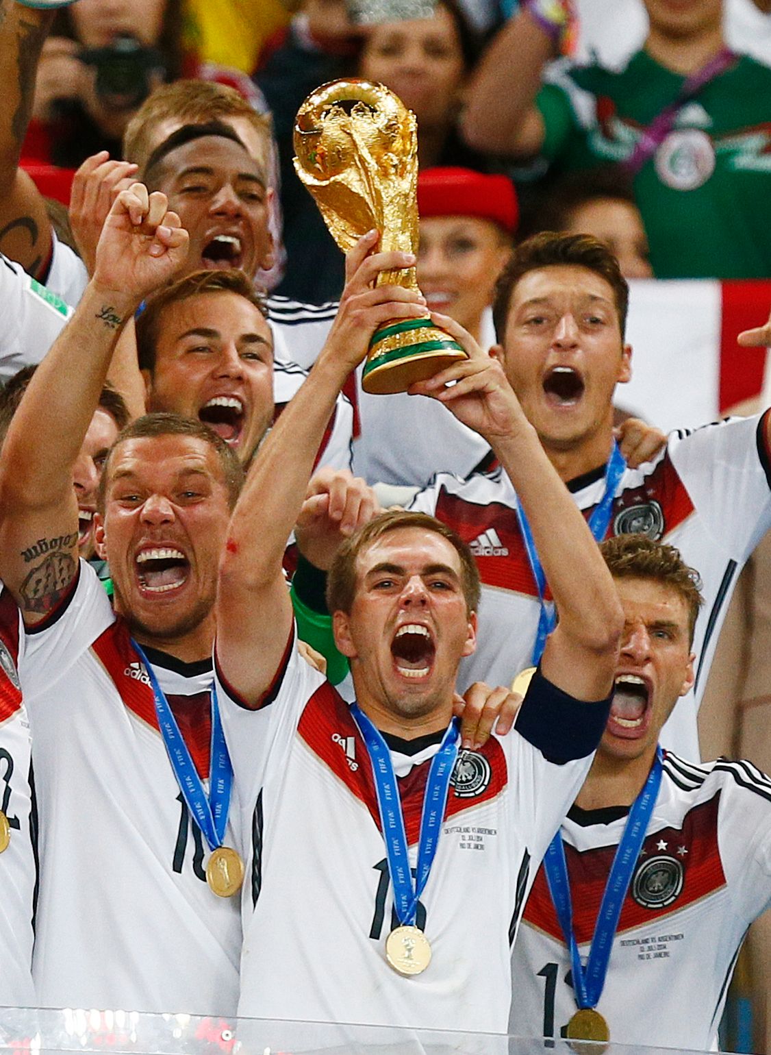Lahm lifts the World Cup.