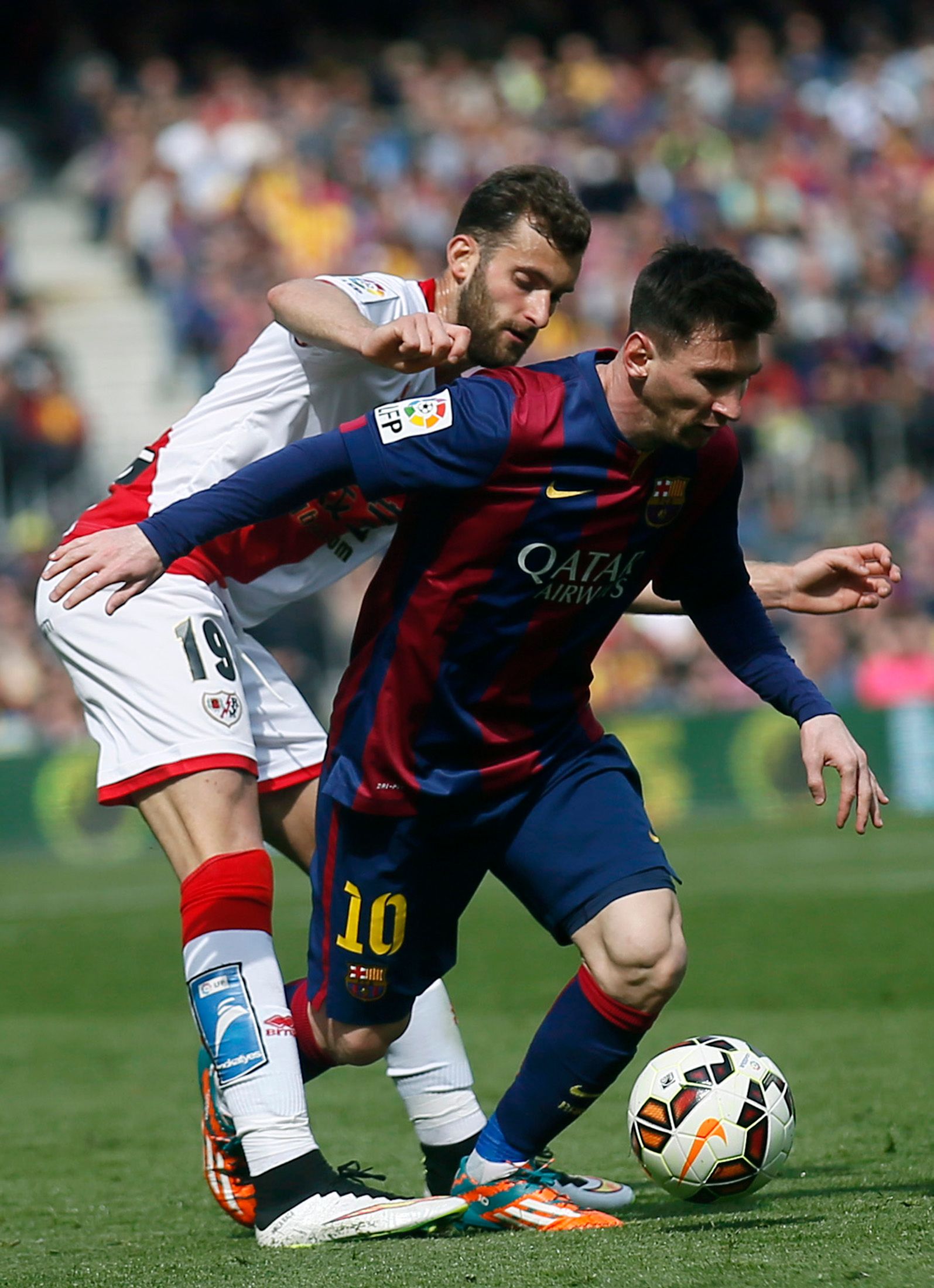 Messi dribbling for Barcelona.