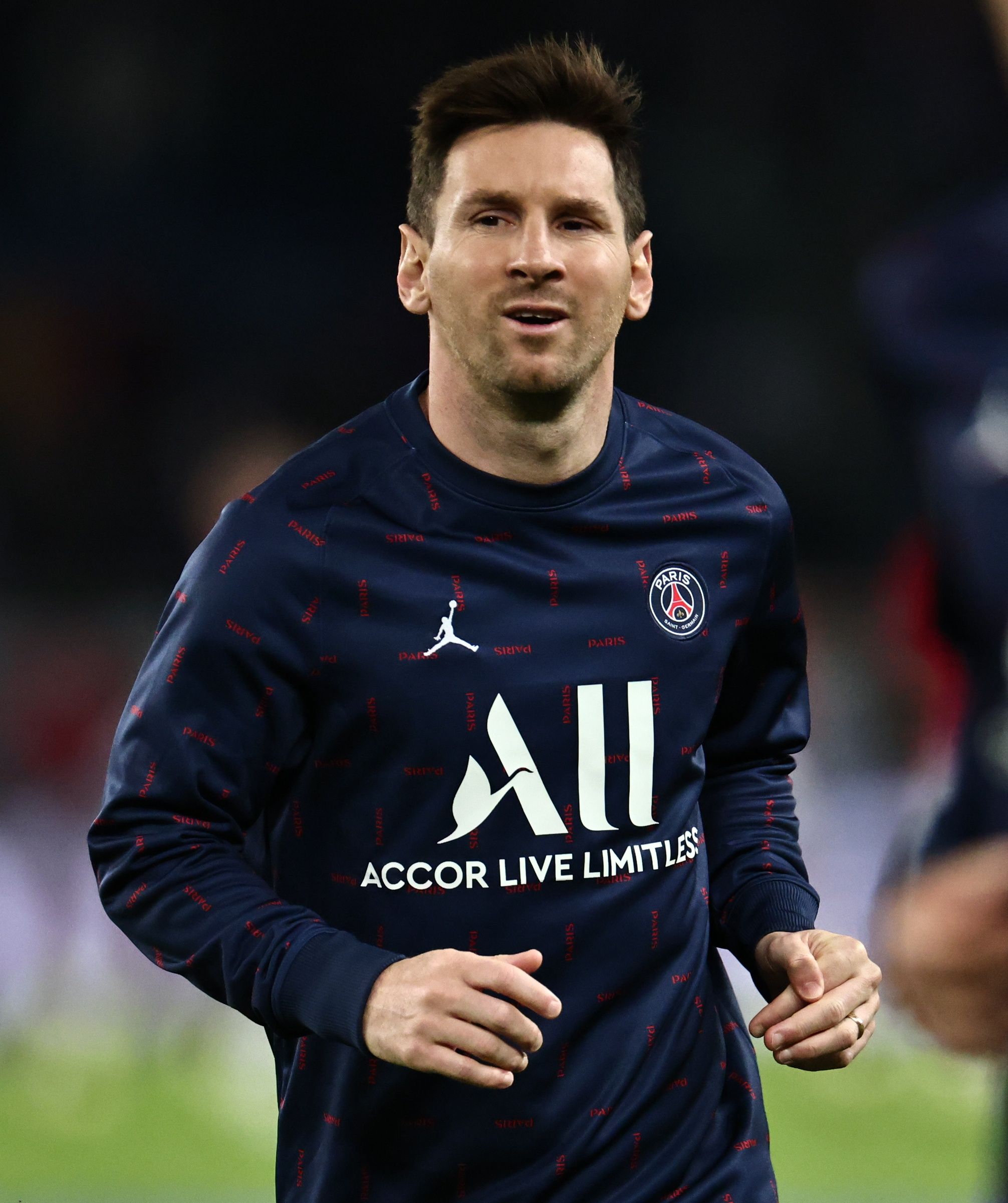 PSG's Messi warms up.