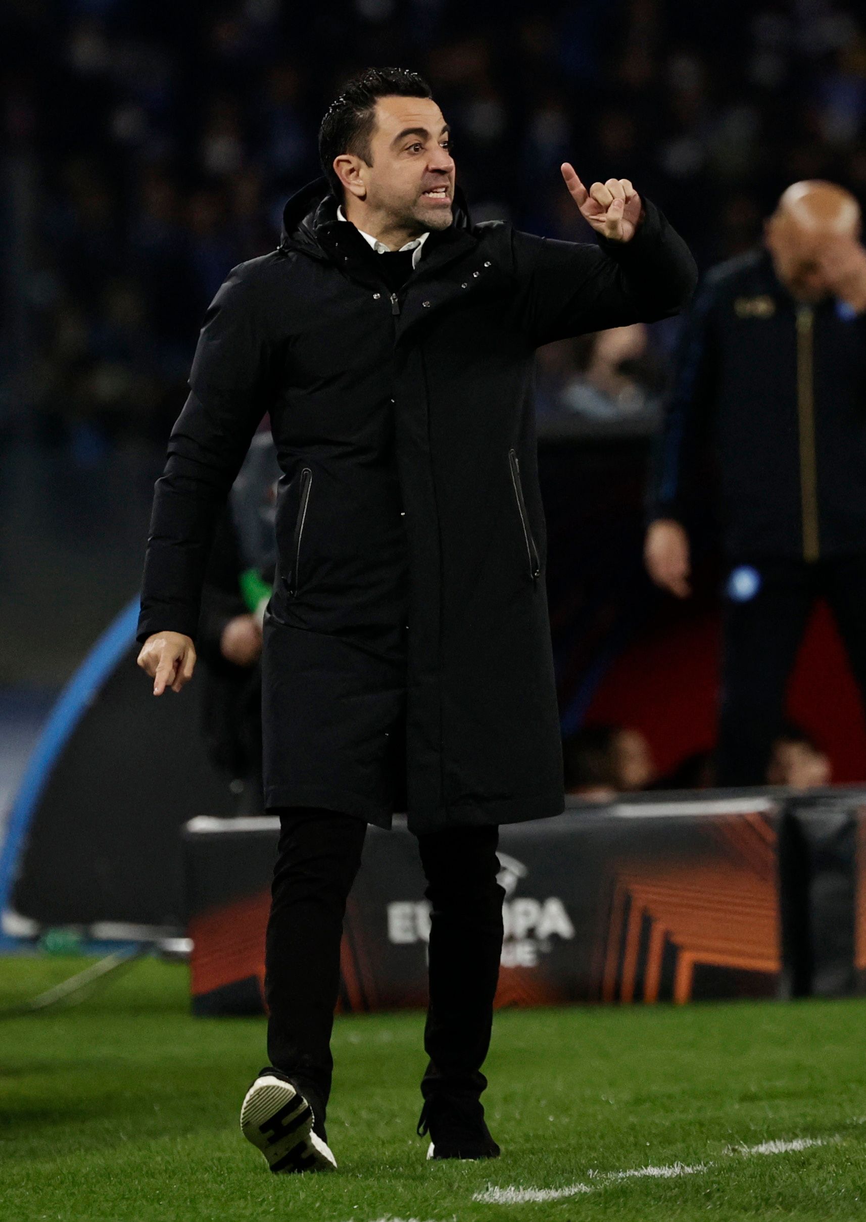 Xavi managing Barcelona.