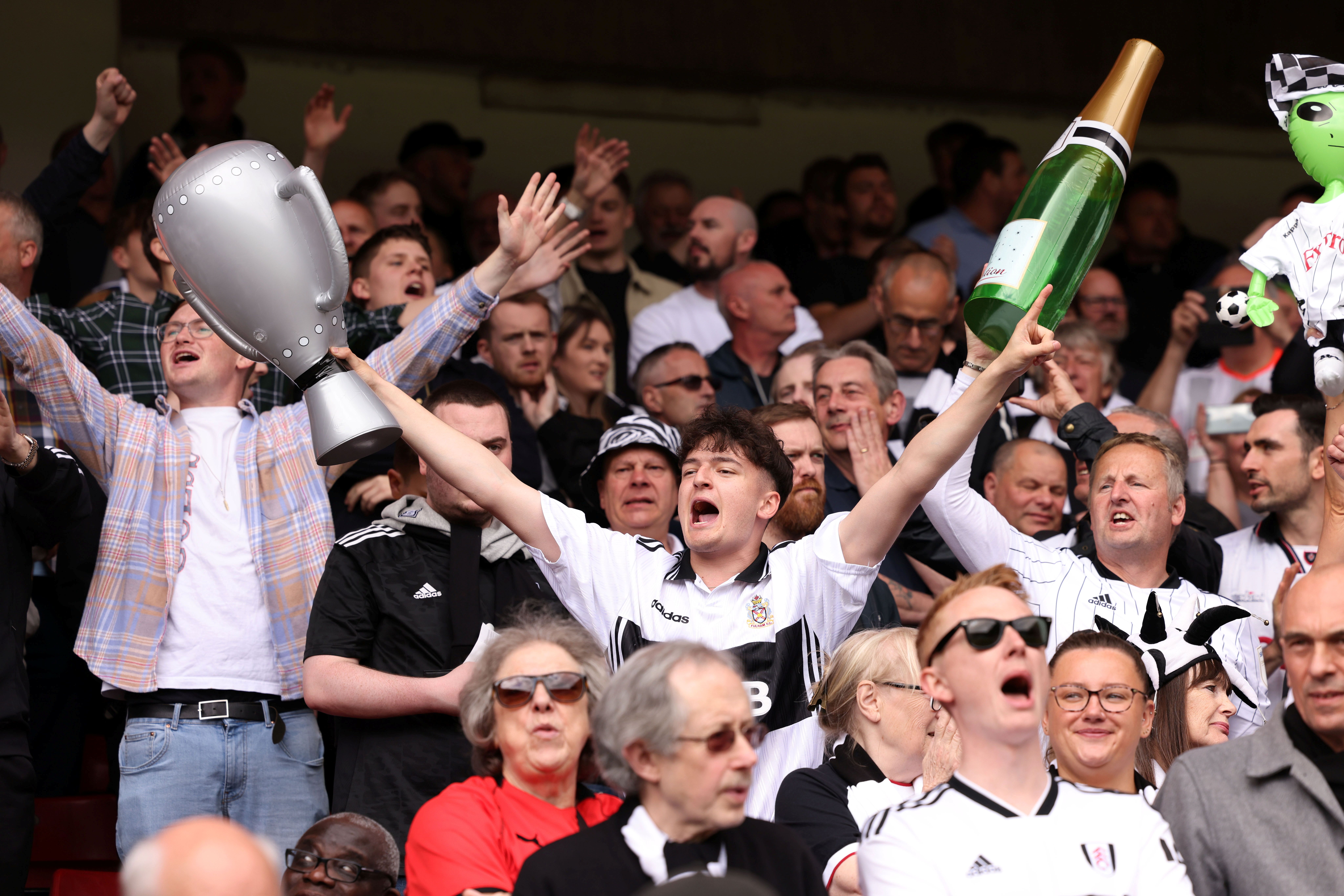 Fulham fans cheer.
