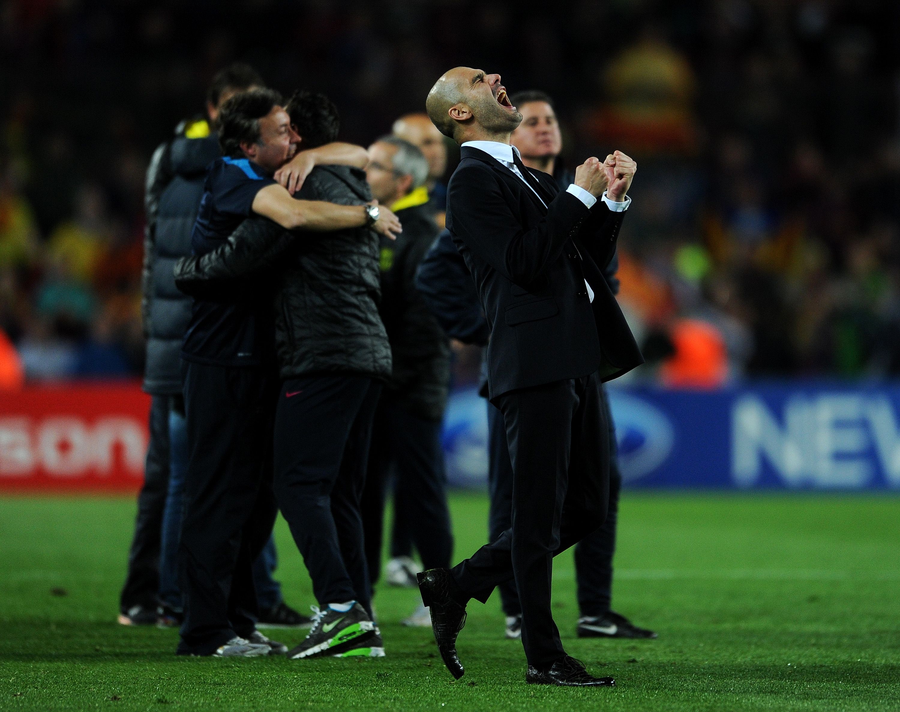 Pep Guardiola celebrates Barcelona's victory over Real Madrid