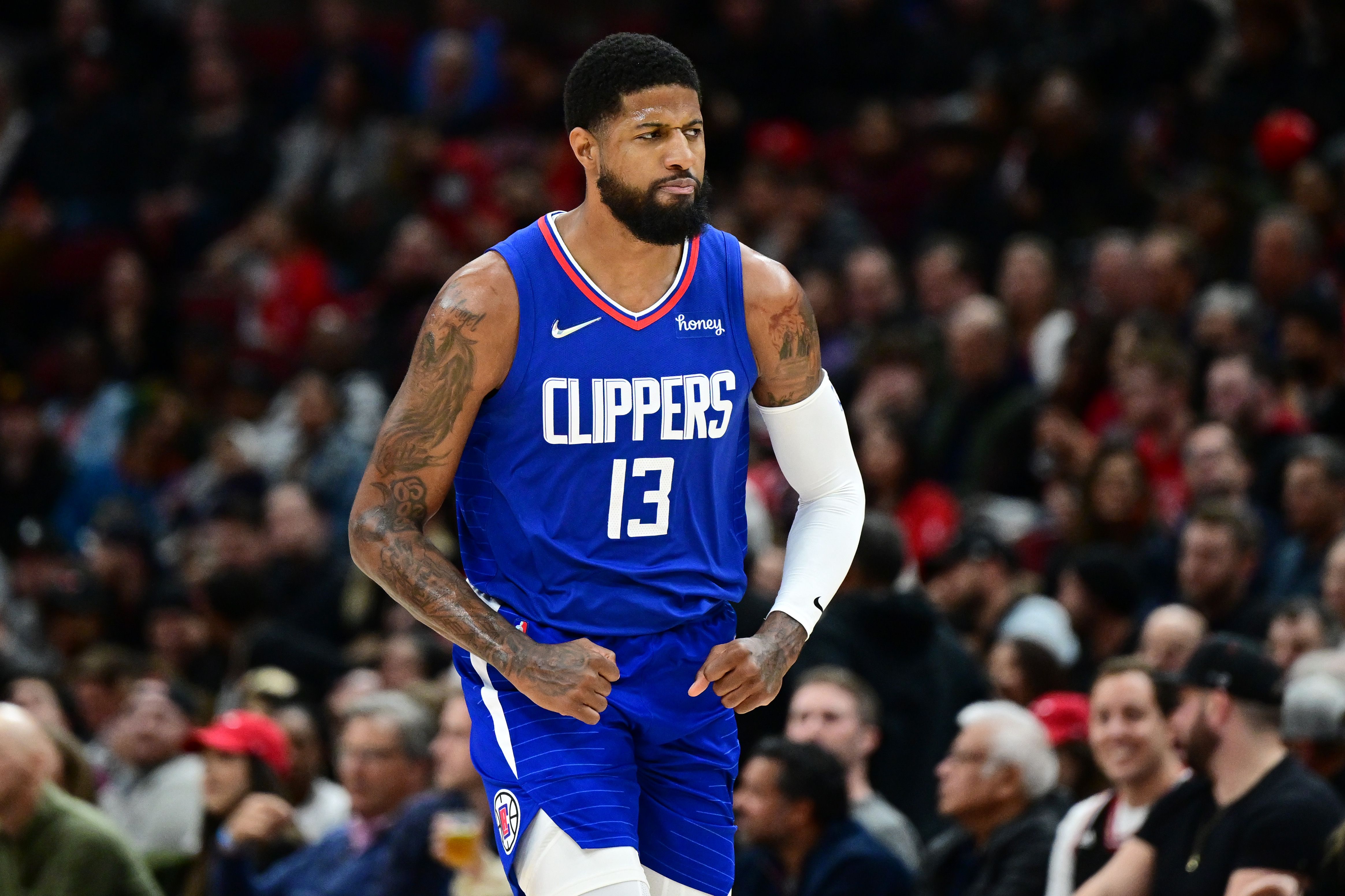 Paul George #13 of the Los Angeles Clippers reacts after making a three point basket in the first half against the Chicago Bulls at United Center on March 31, 2022