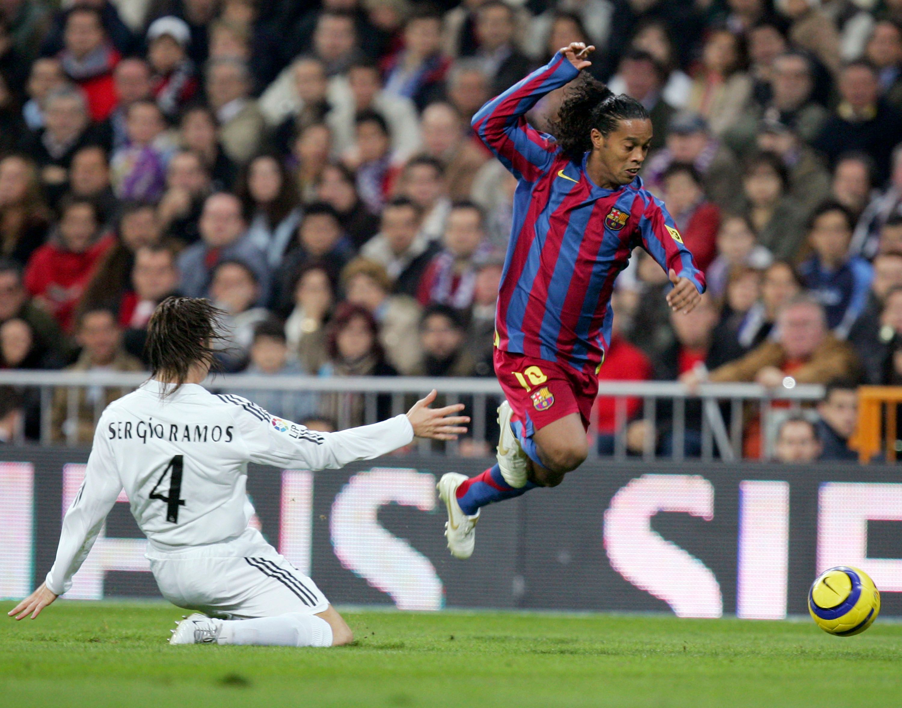 Sergio Ramos attempts to tackle Ronaldinho