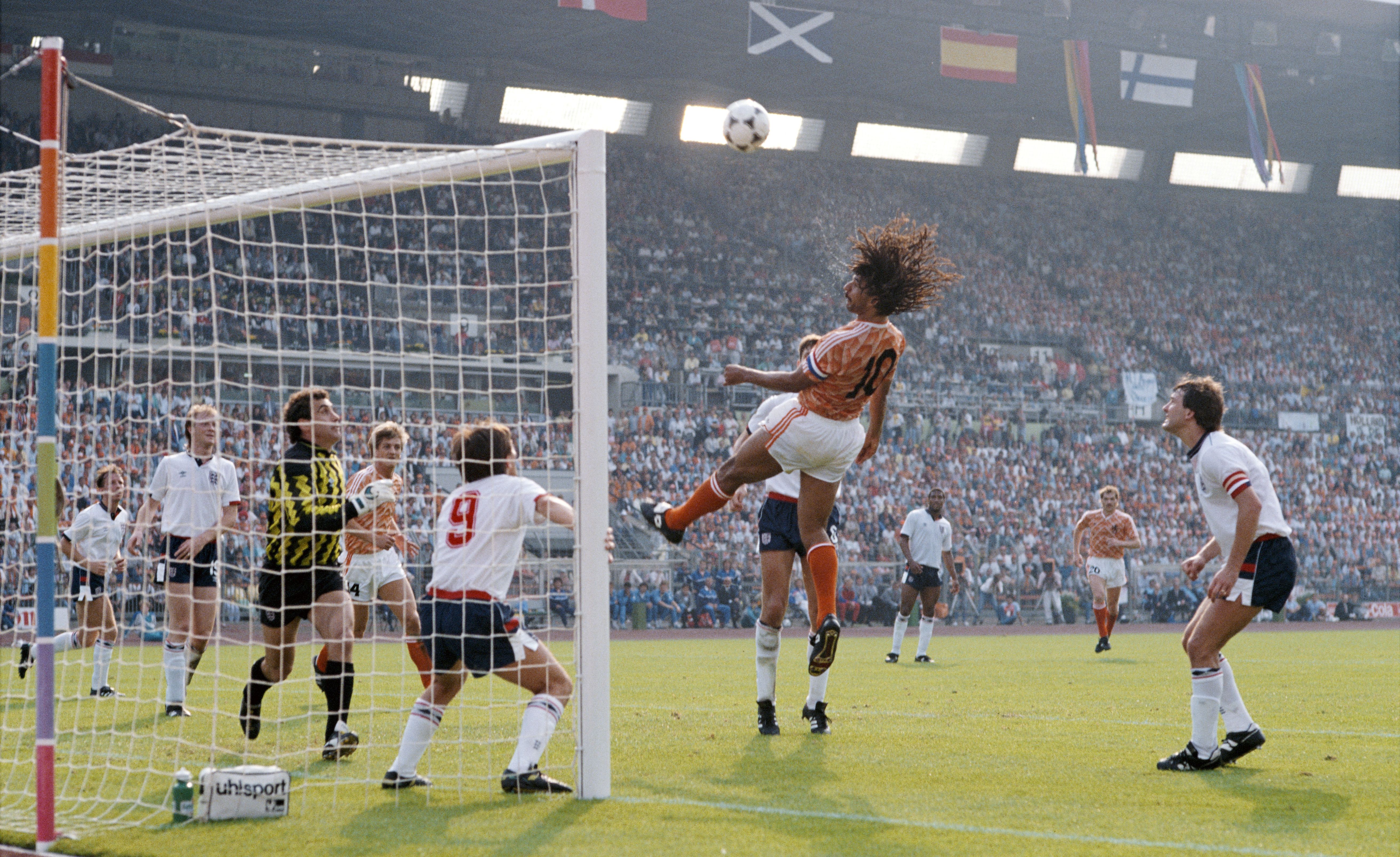 Ruud Gullit of Holland heads towards goal watched by Peter Shilton, Peter Beardsley (9) and Bryan Robson (r) during the European Championship match against England