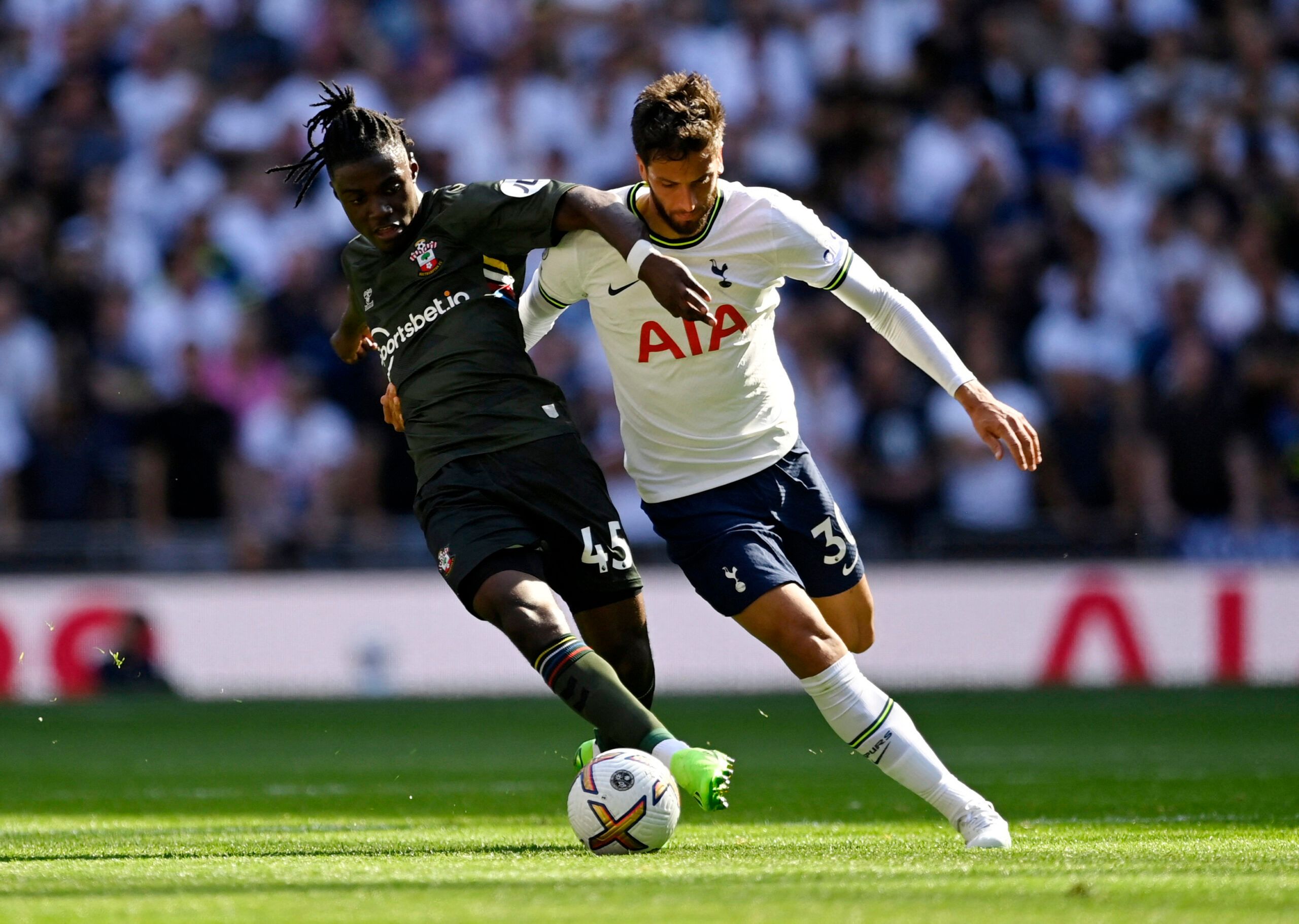 Southampton's Romeo Lavia holds off Rodrigo Bentancur of Tottenham Hotspur