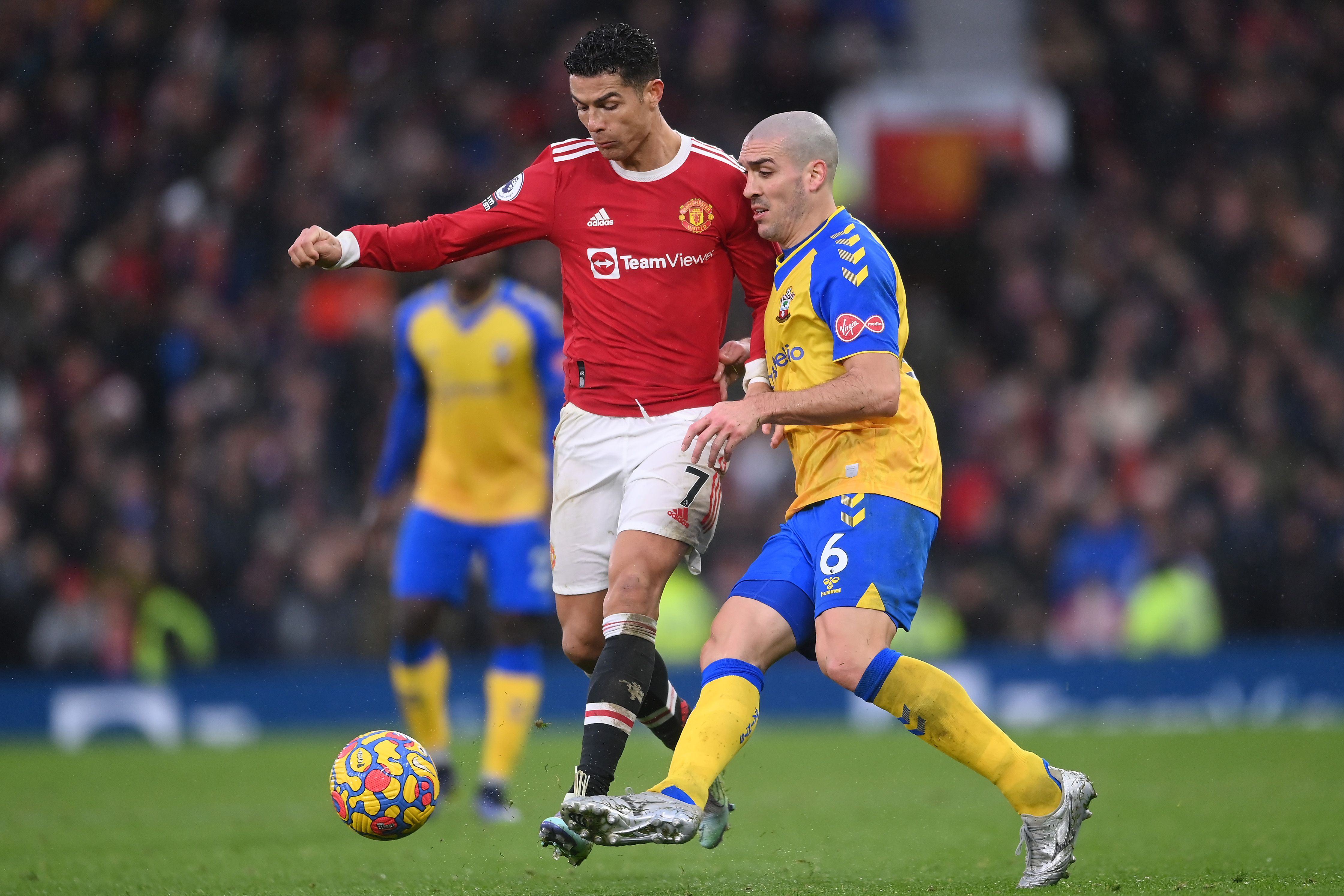 Cristiano Ronaldo of Manchester United is challenged by Oriol Romeu of Southampton