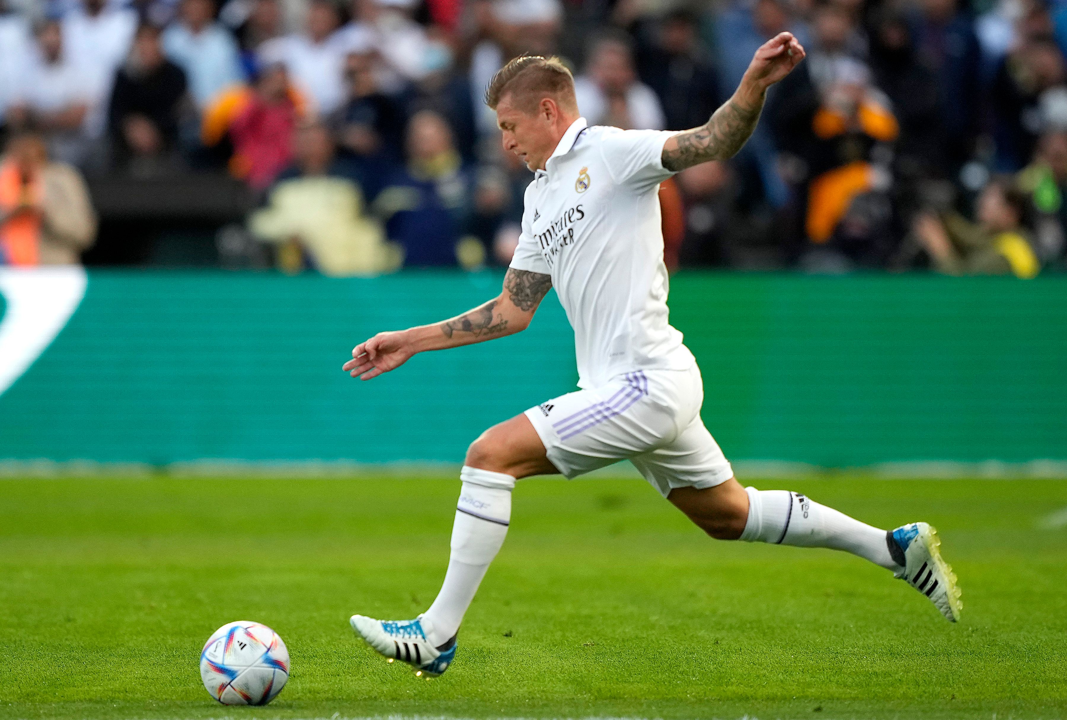 Toni Kroos #8 of Real Madrid looks to pass