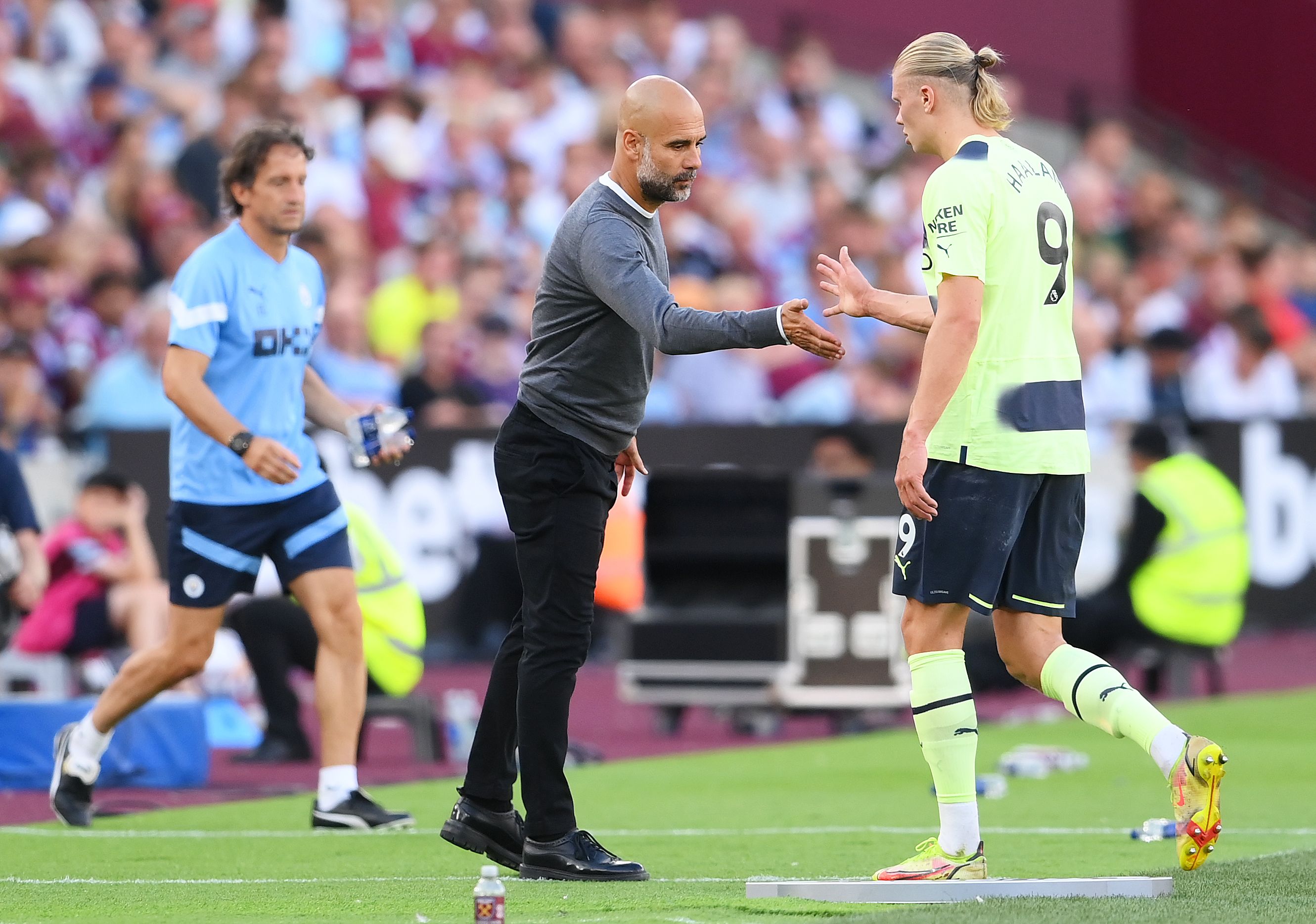 Pep Guardiola and Erling Haaland during the win over West Ham
