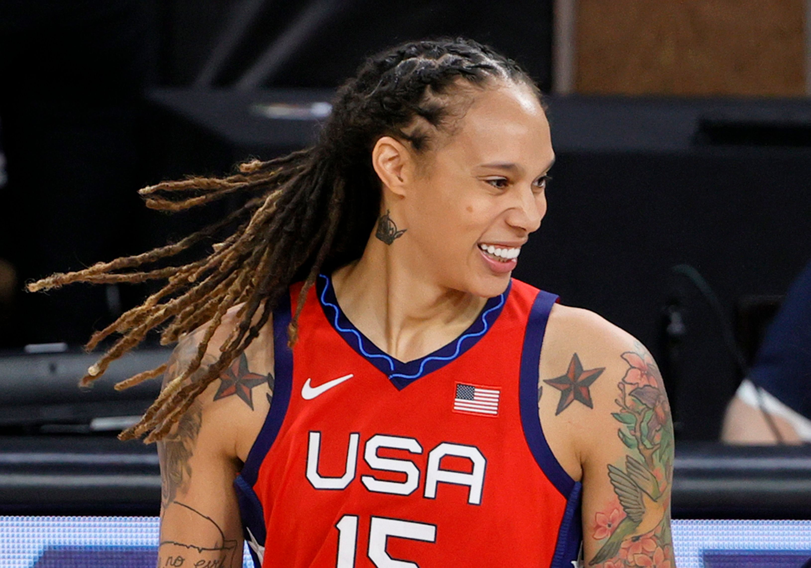 Brittney Griner smiles while in action for the USA Women's basketball team