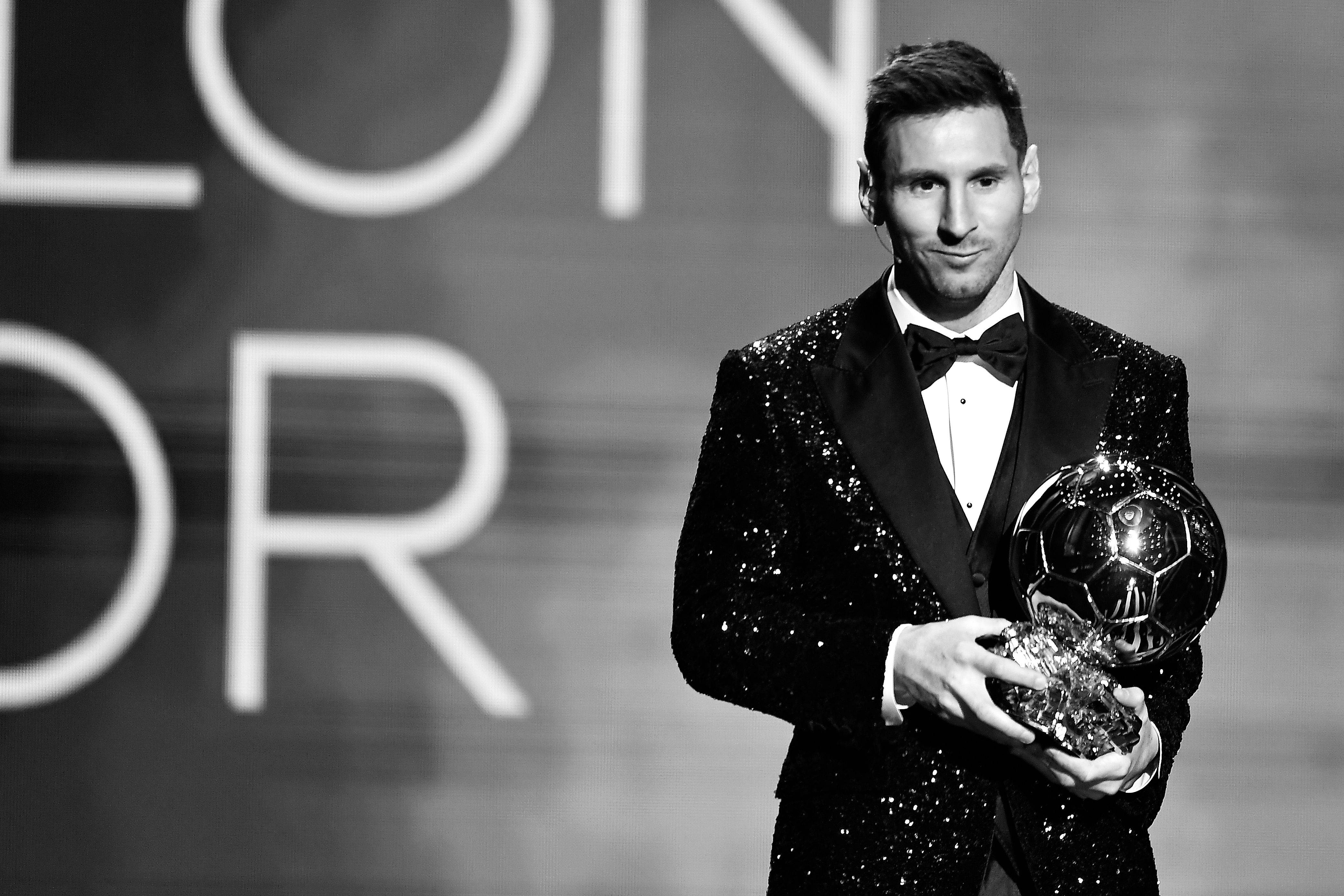Lionel Messi with the Ballon d'Or