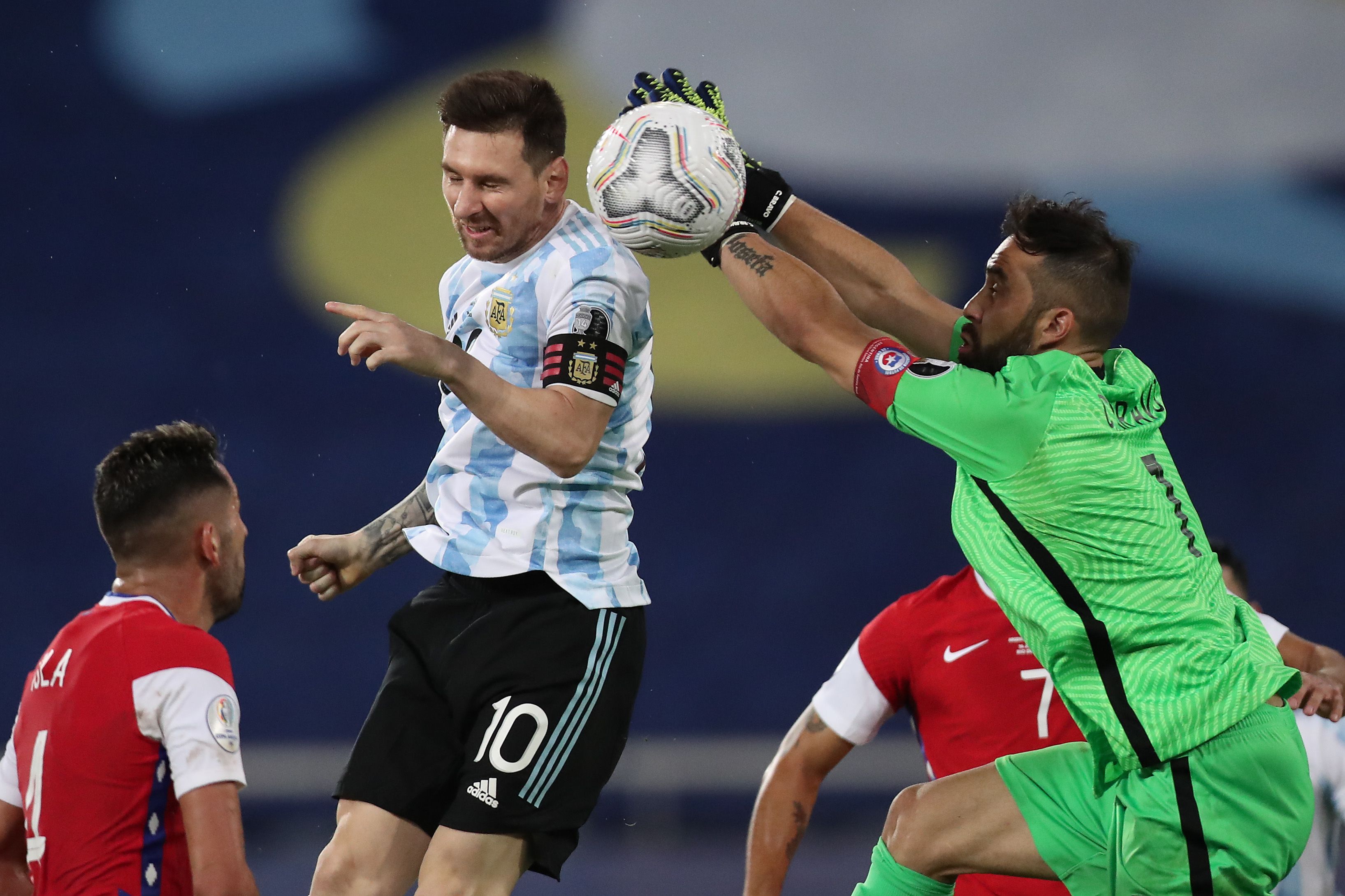 Lionel Messi of Argentina jumps for the ball