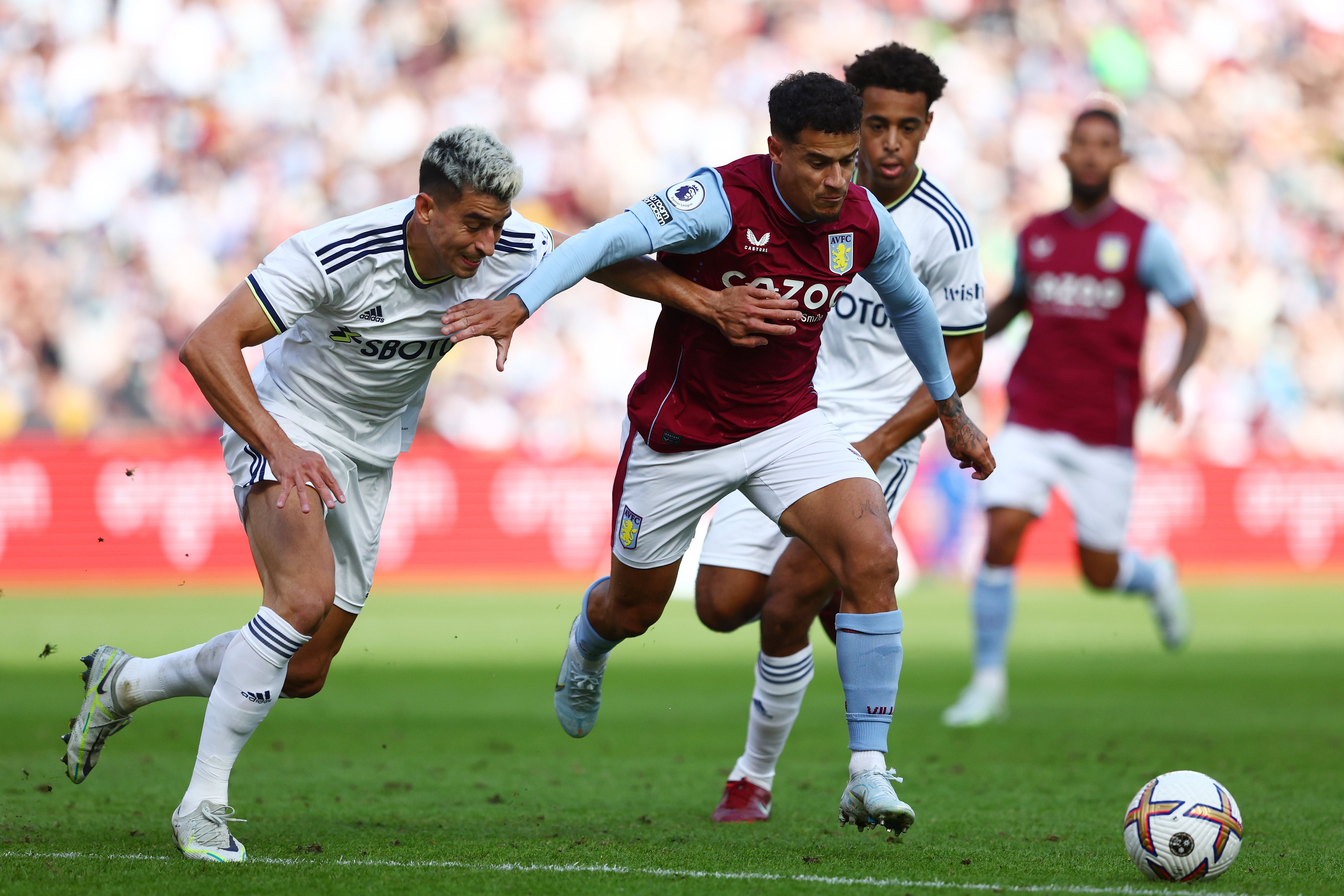 Philippe Coutinho of Aston Villa takes on the defence
