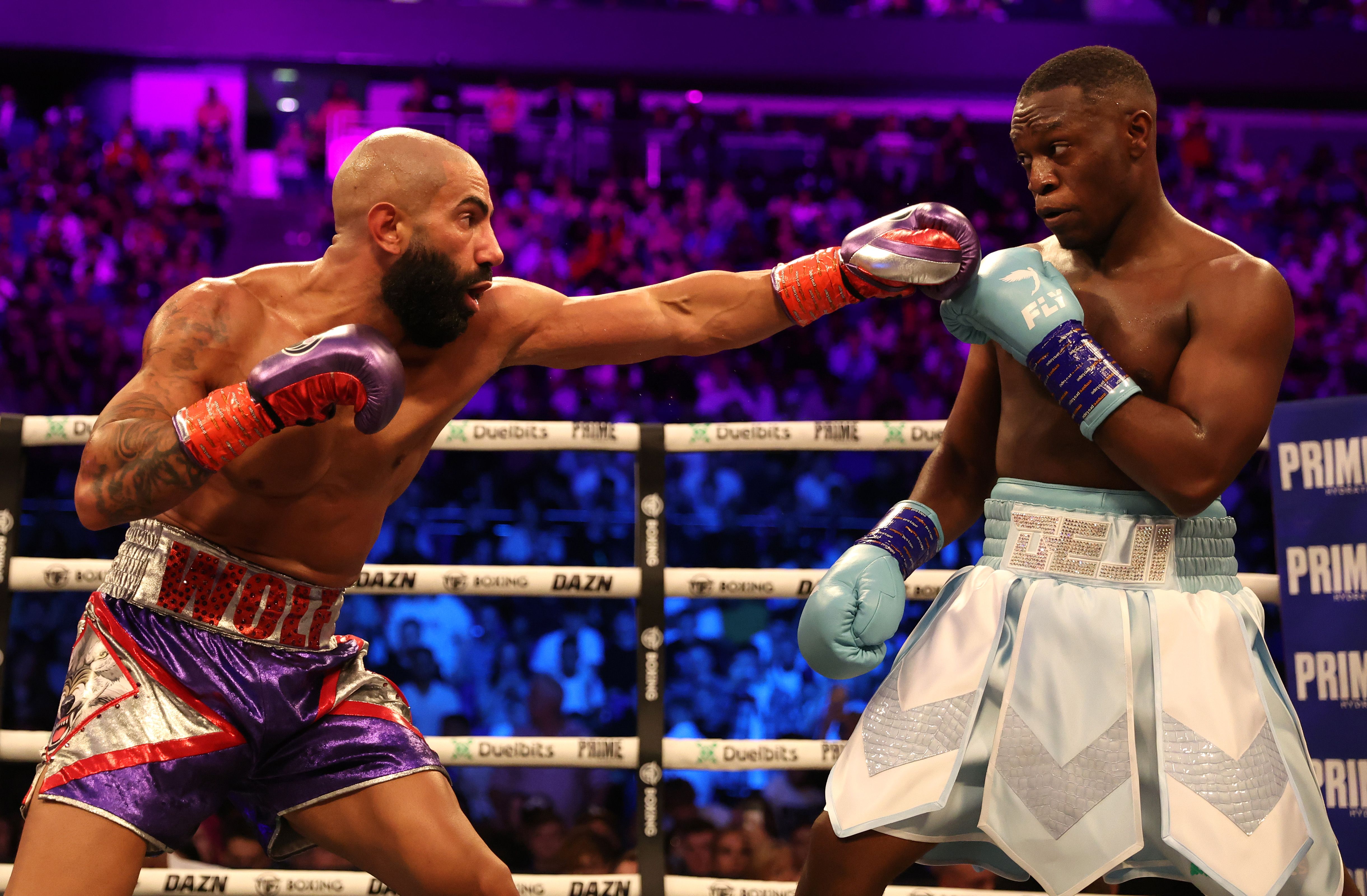 Deji (R) throws a punch during his Light Heavyweight Bout against Fousey (L) at The O2 Arena on August 27, 2022 in London, England