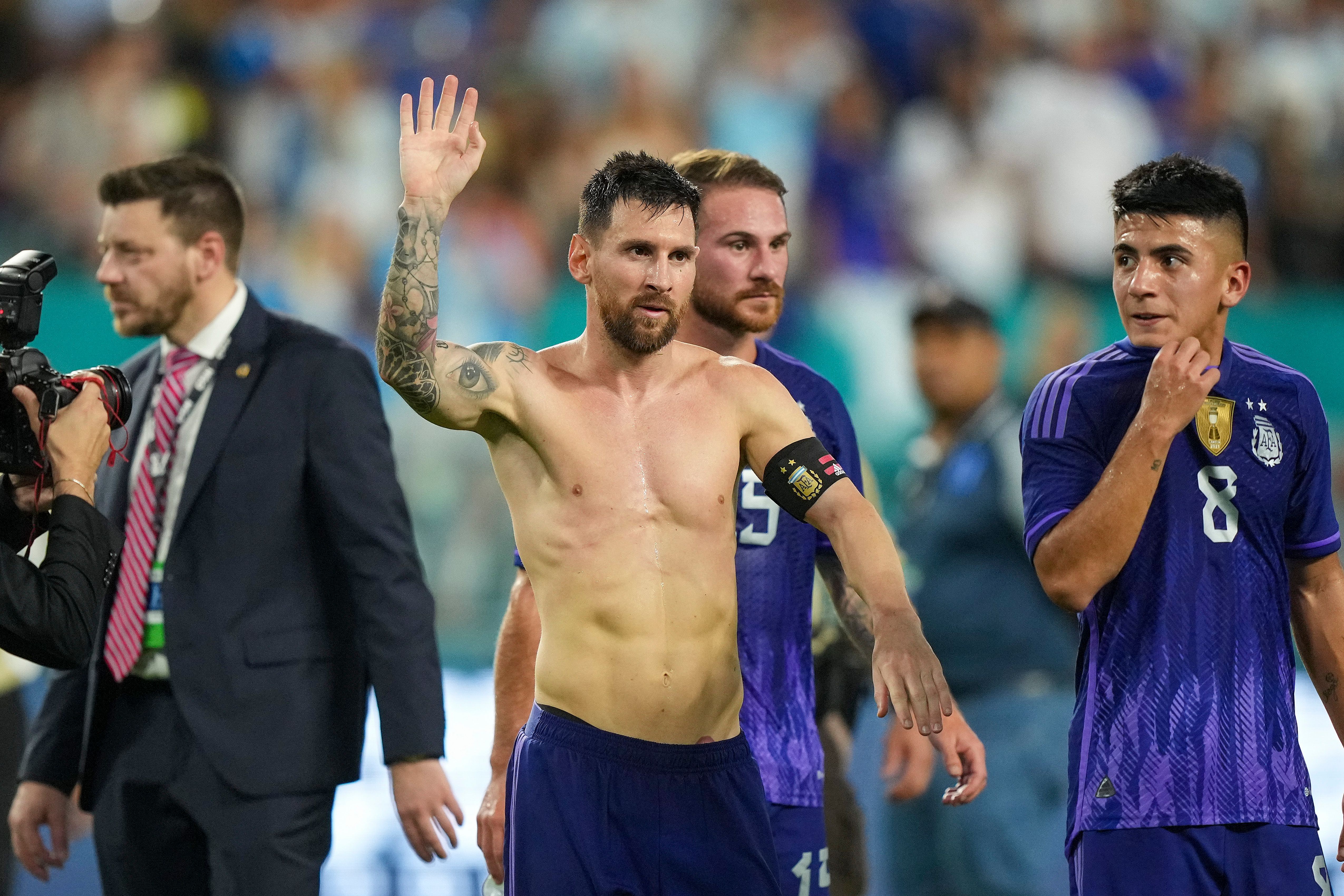 Lionel Messi walks off the field