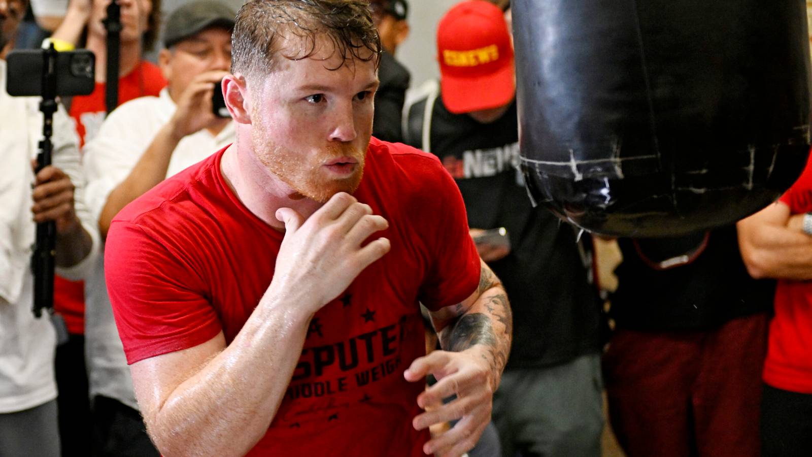 Canelo Alvarez highlights brutal weight cut as he drains cups of sweat ...