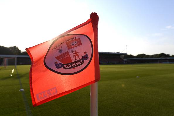 The Crawley badge on a corner flag.