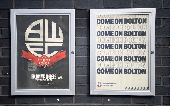Bolton's badge on a poster.