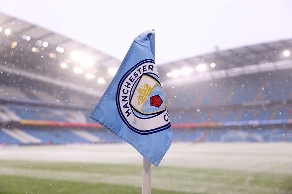 Man City's badge in the snow.