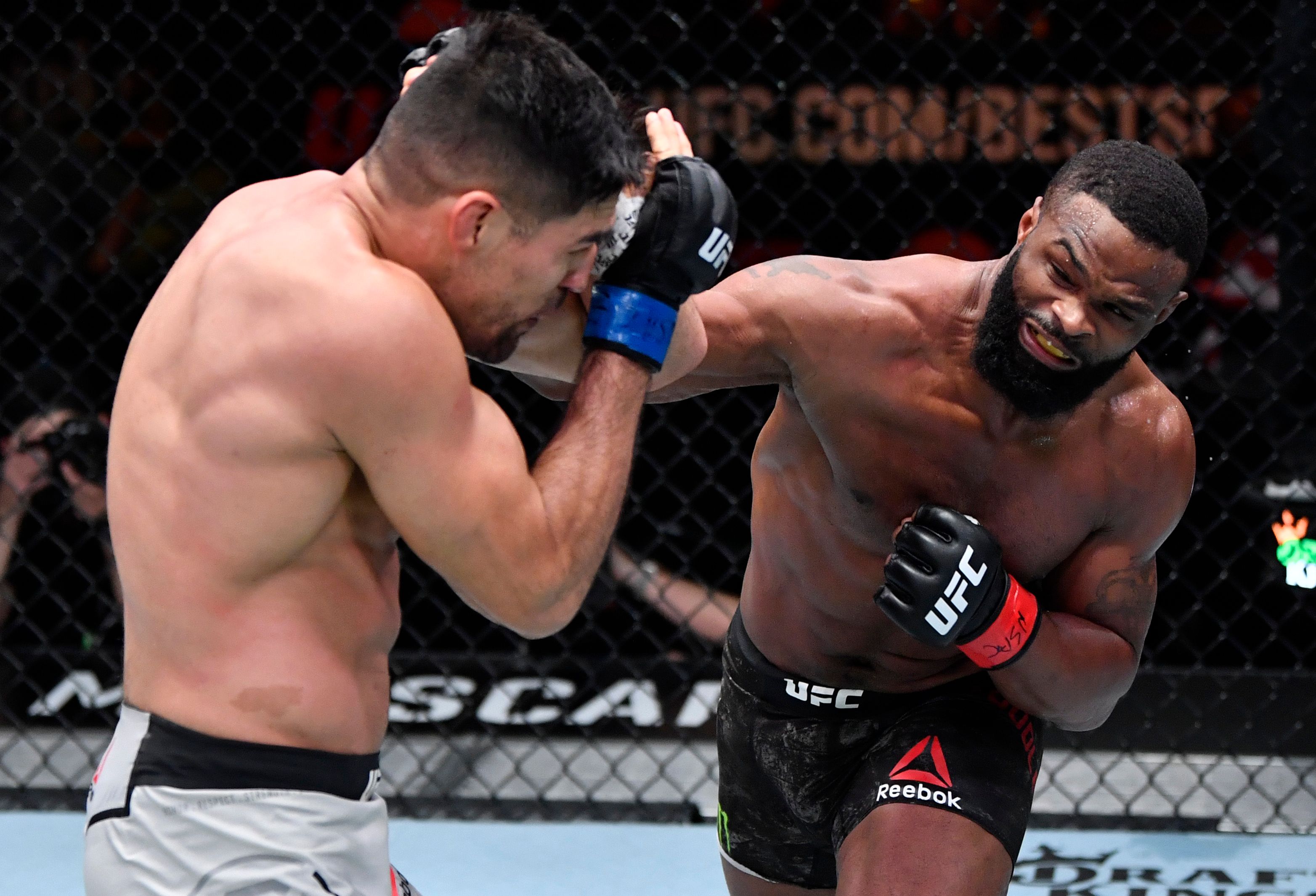 Tyron Woodley punching Vicente Luque