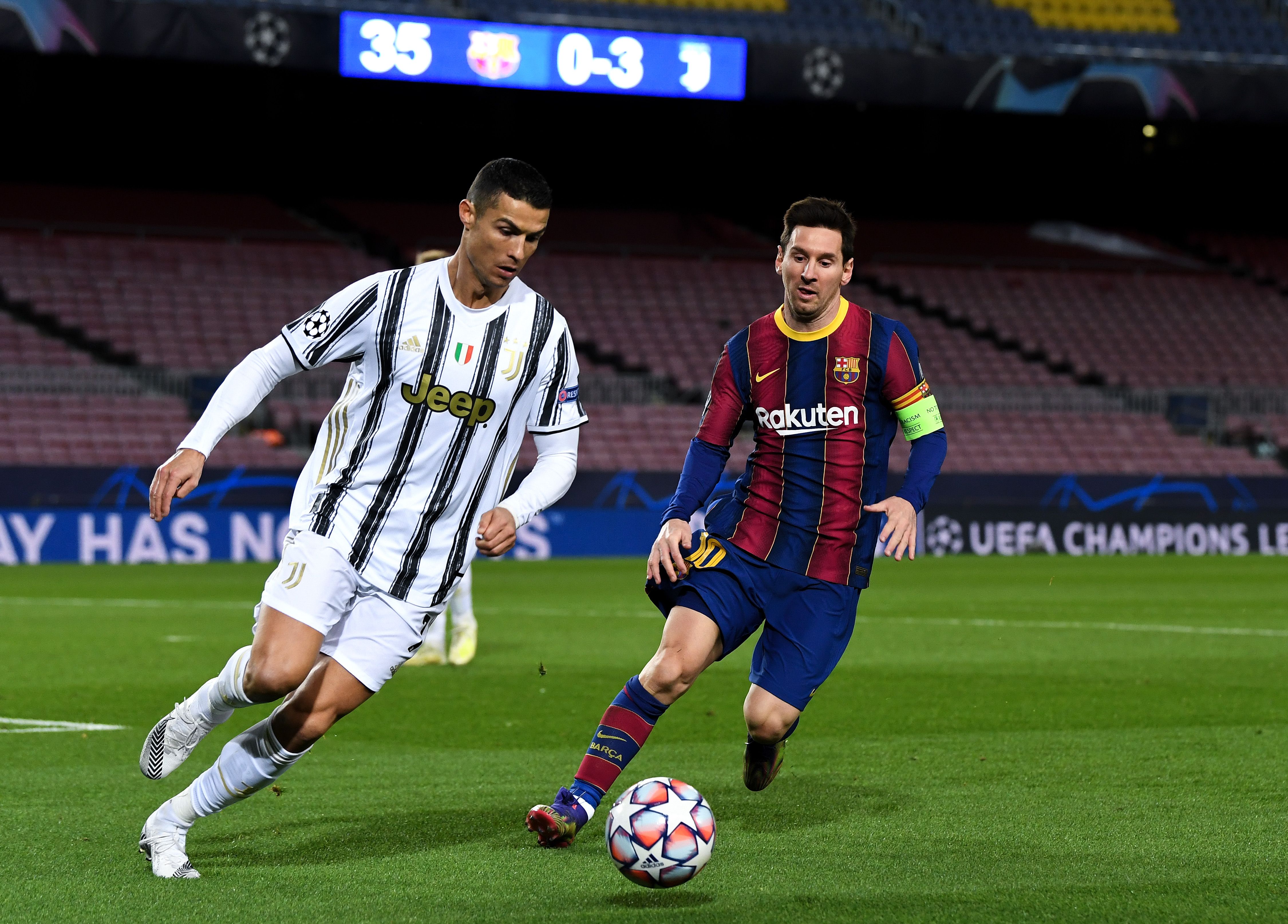 Cristiano Ronaldo of Juventus F.C. is put under pressure by Lionel Messi of Barcelona during the UEFA Champions League Group G stage match between FC Barcelona and Juventus at Camp Nou on December 08, 2020 in Barcelona, Spain. Sporting stadiums around Spain remain under strict restrictions due to the Coronavirus Pandemic as Government social distancing laws prohibit fans inside venues resulting in games being played behind closed doors. 