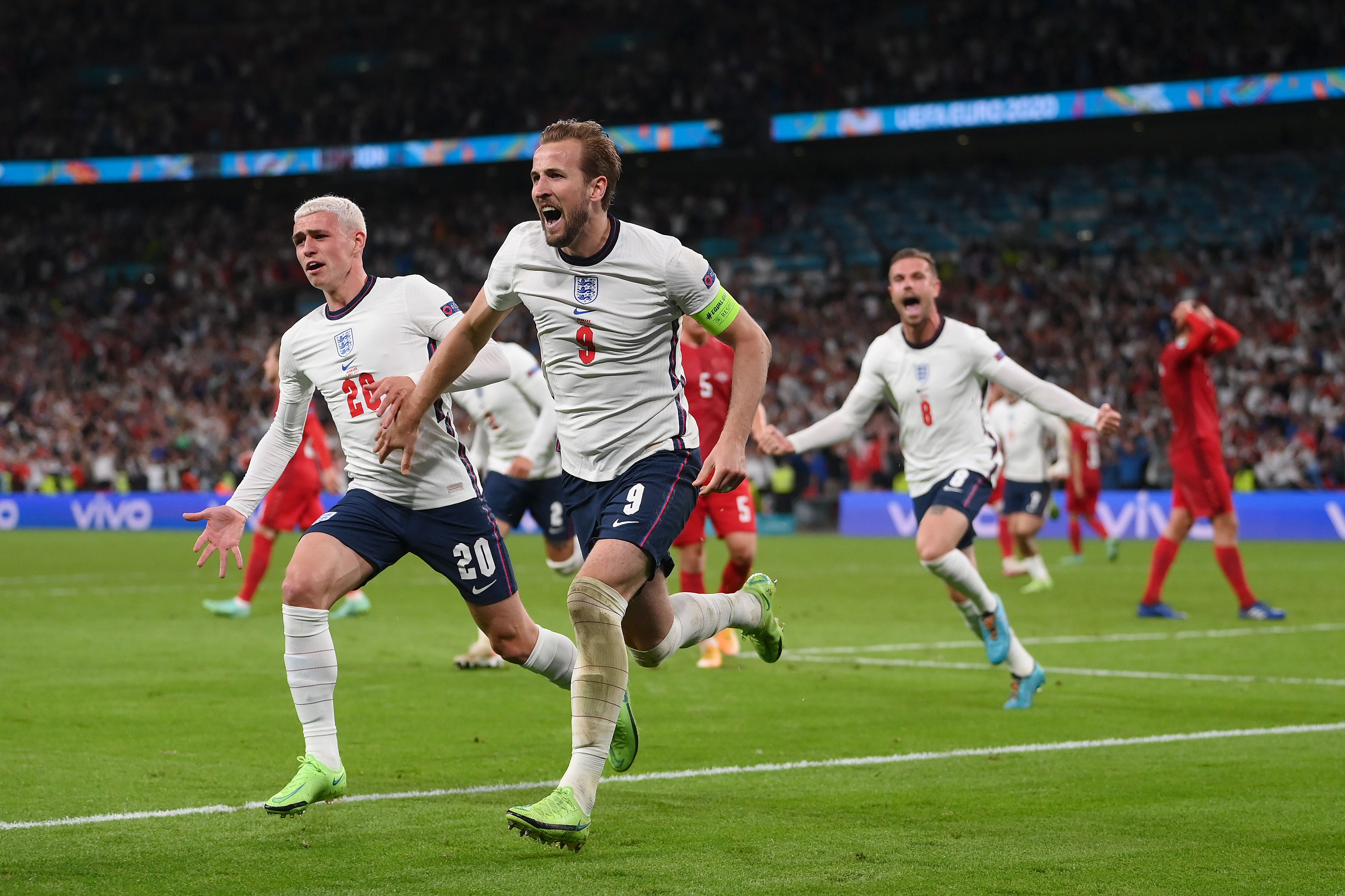 Harry Kane of England is congratulated by Phil Foden after scoring the second goal during the UEFA Euro 2020 Championship Semi-final match