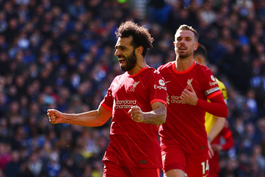 Jordan henderson and Mo Salah in action for Liverpool