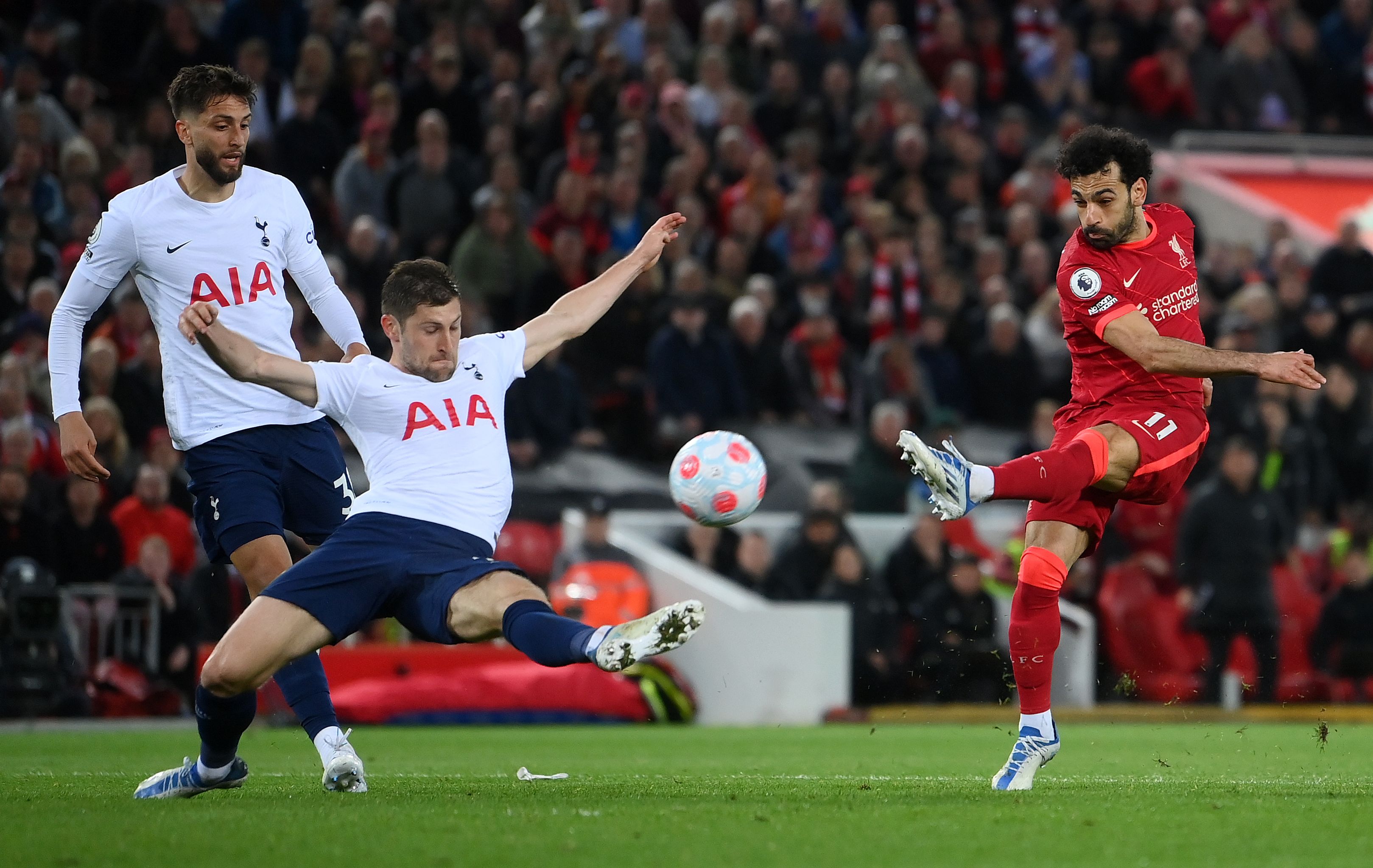 Mohamed Salah of Liverpool shoots under pressure from Ben Davies of Tottenham Hotspur
