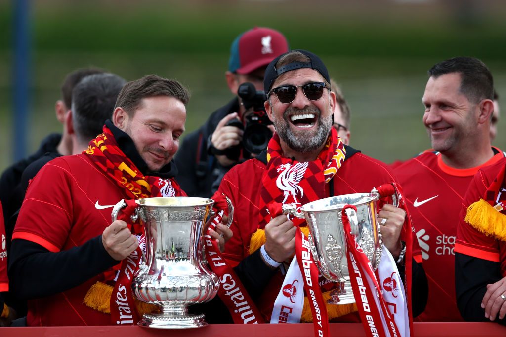 Jurgen Klopp with the FA Cup and League Cup trophy in 2022