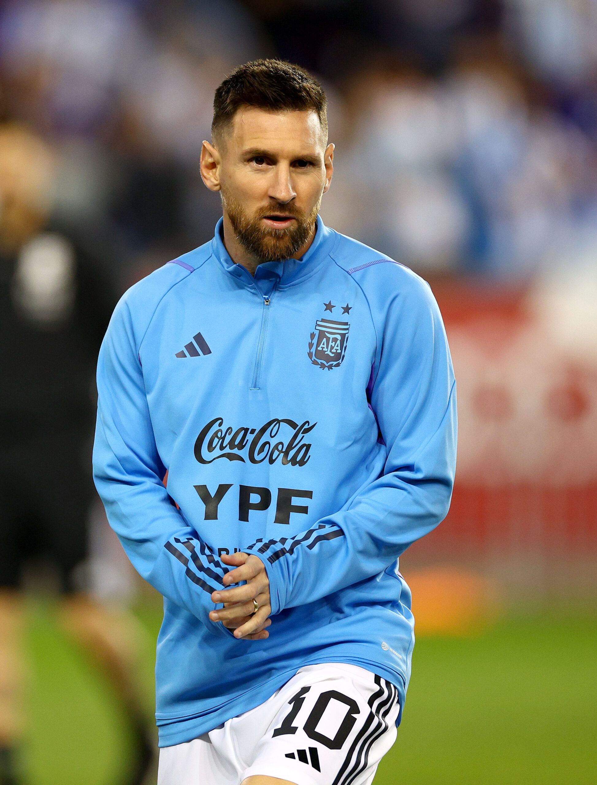 Lionel Messi warms up with Argentina