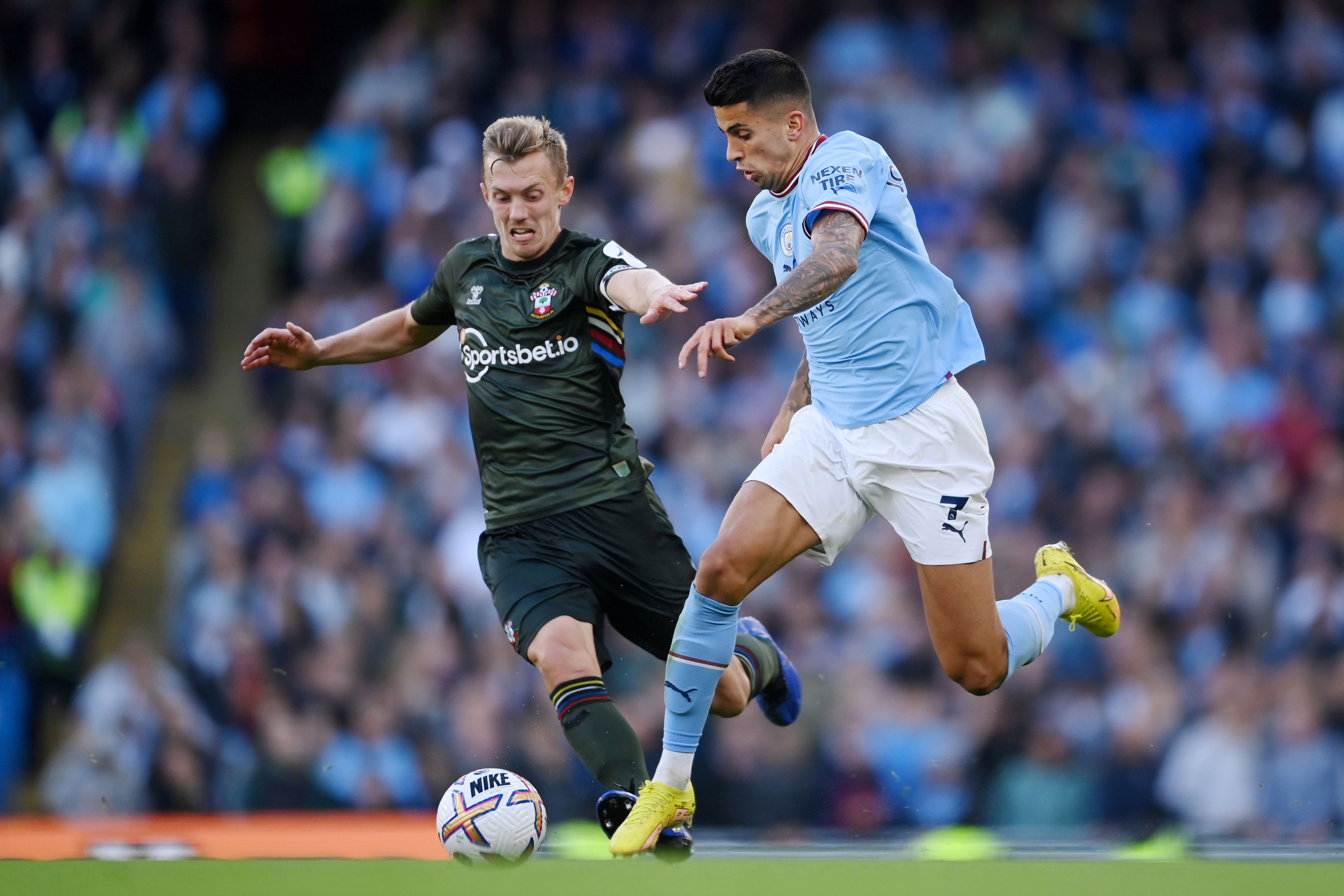 Joao Cancelo challenged by James Ward-Prowse