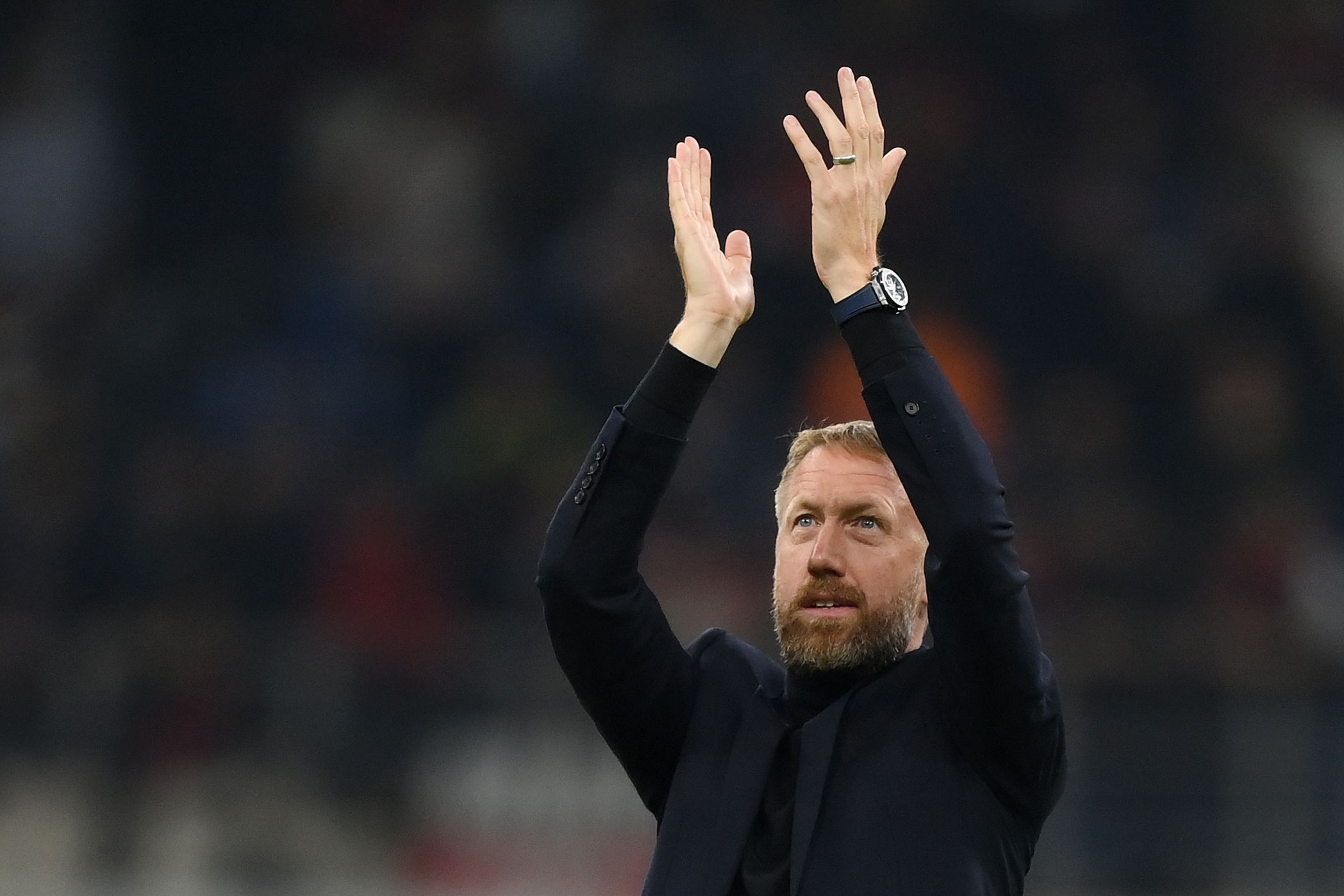Graham Potter, Manager of Chelsea applauds the fans