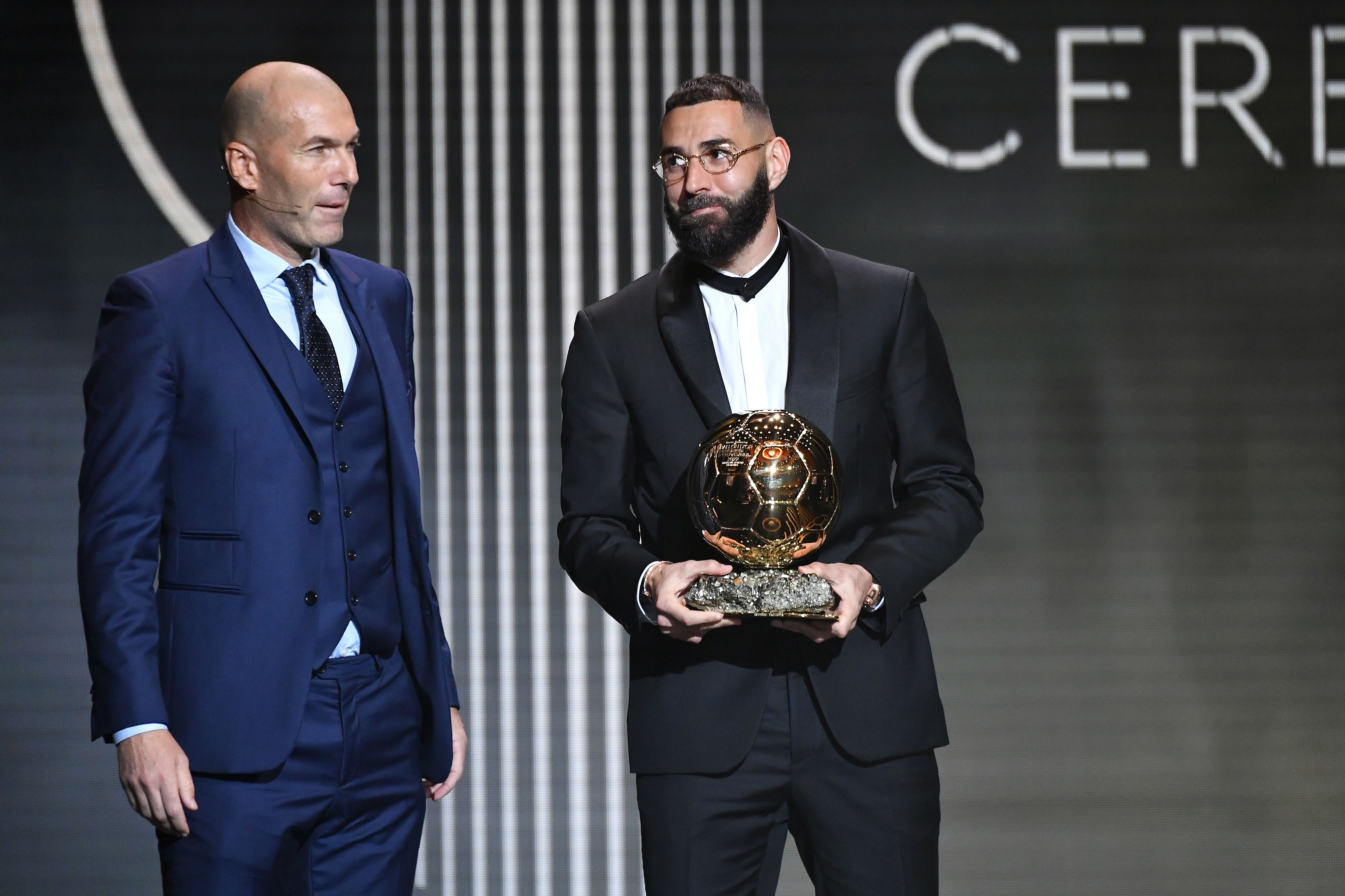 Karim Benzema (R) receives the Ballon d'Or award from Zinedine Zidane (L) during the Ballon D'Or ceremony at Theatre Du Chatelet In Paris on October 17, 2022 in Paris, France