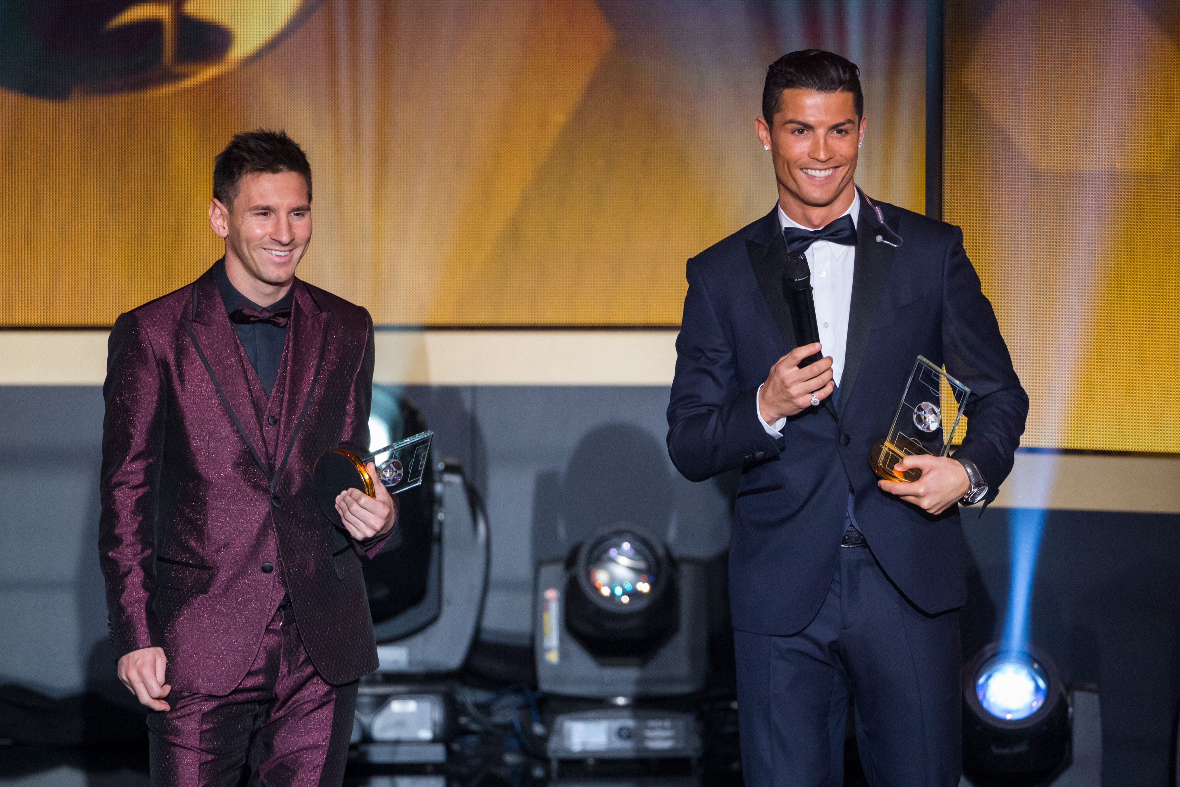  FIFA Ballon d'Or nominees Lionel Messi of Argentina and FC Barcelona (L) and Cristiano Ronaldo of Portugal and Real Madrid smile during the FIFA Ballon d'Or Gala 2014 at the Kongresshaus on January 12, 2015 in Zurich, Switzerland