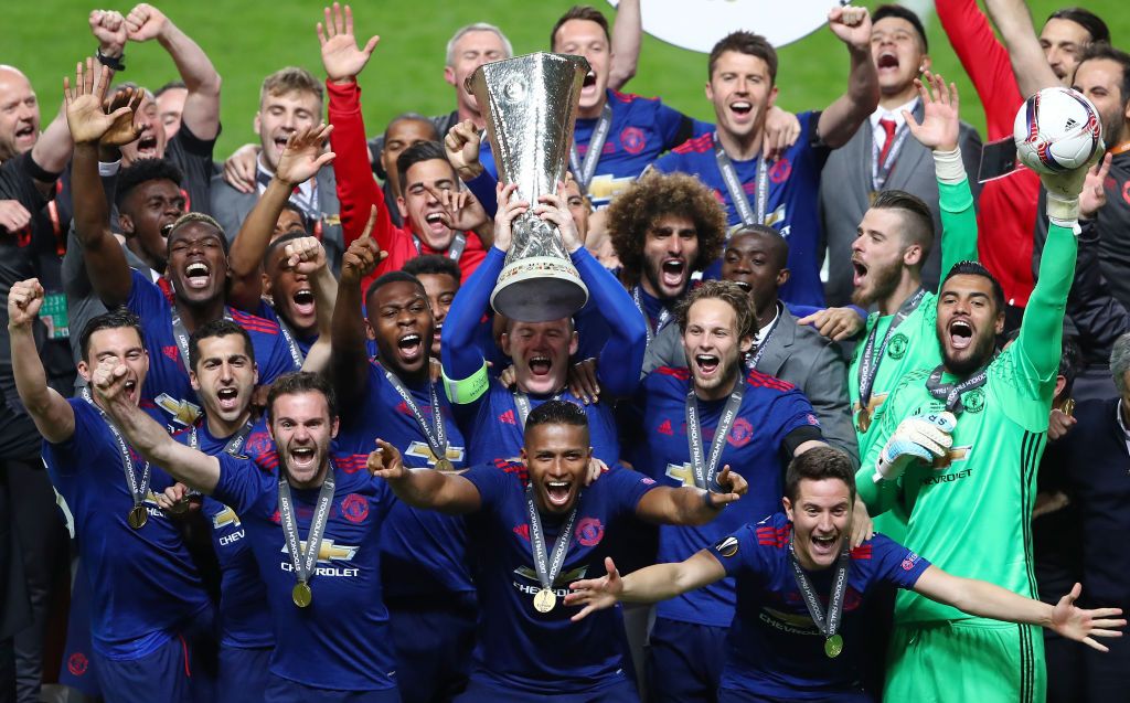 Manchester United players celebrate with the Europa League trophy in 2017