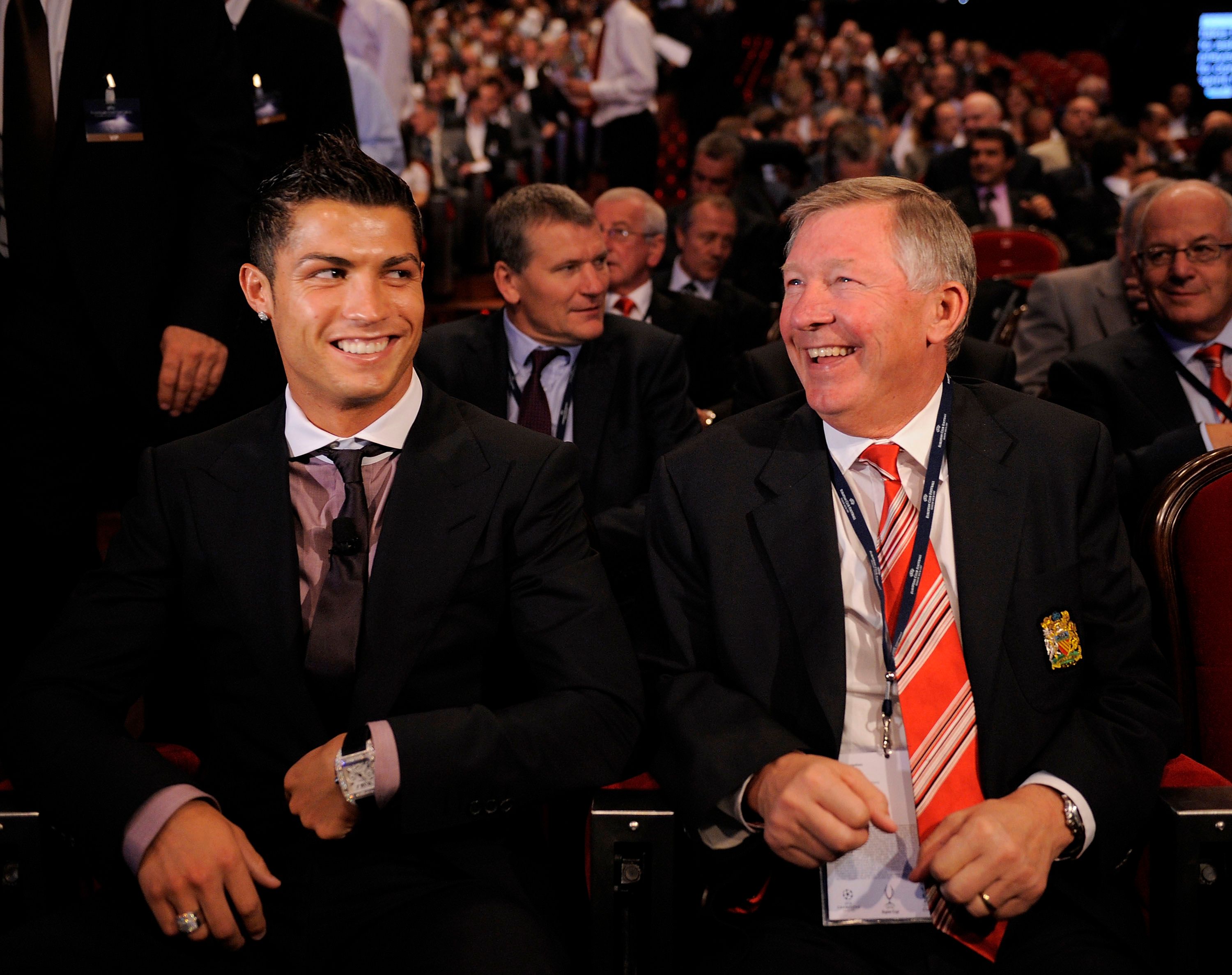 Cristiano Ronaldo laugh with Sir Alex Ferguson
