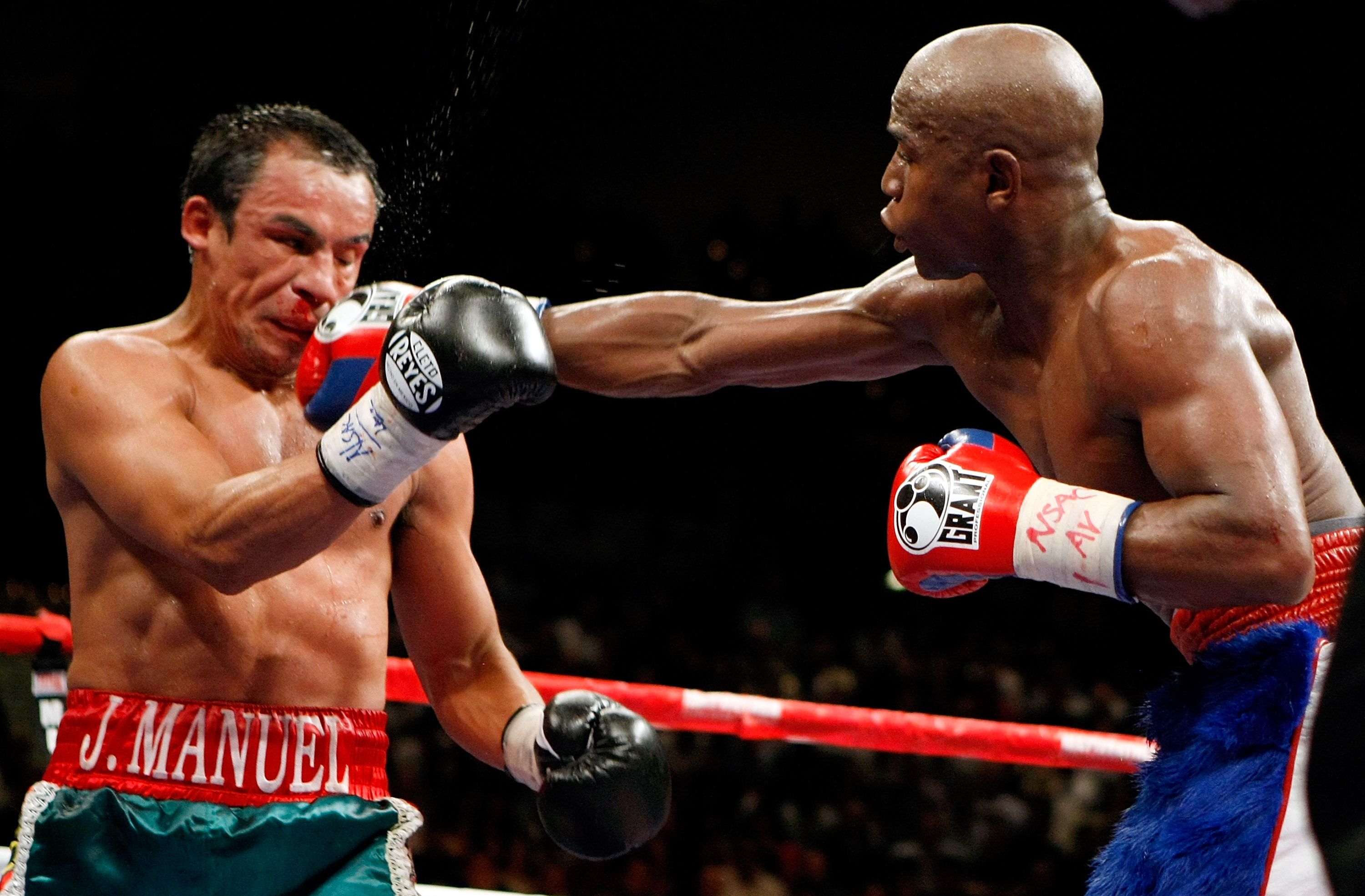 Floyd Mayweather throws a punch at Marquez