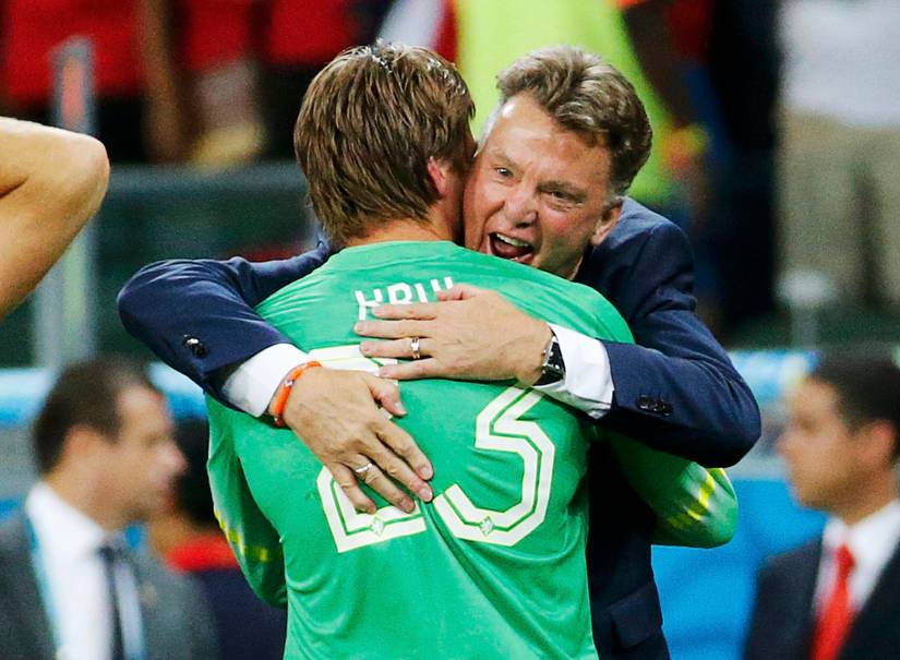 Krul of the Netherlands is hugged by coach Louis van Gaal after making the match winning penalty save in their shootout against Costa Rica during their 2014 World Cup quarter-finals at the Fonte Nova arena in Salvador