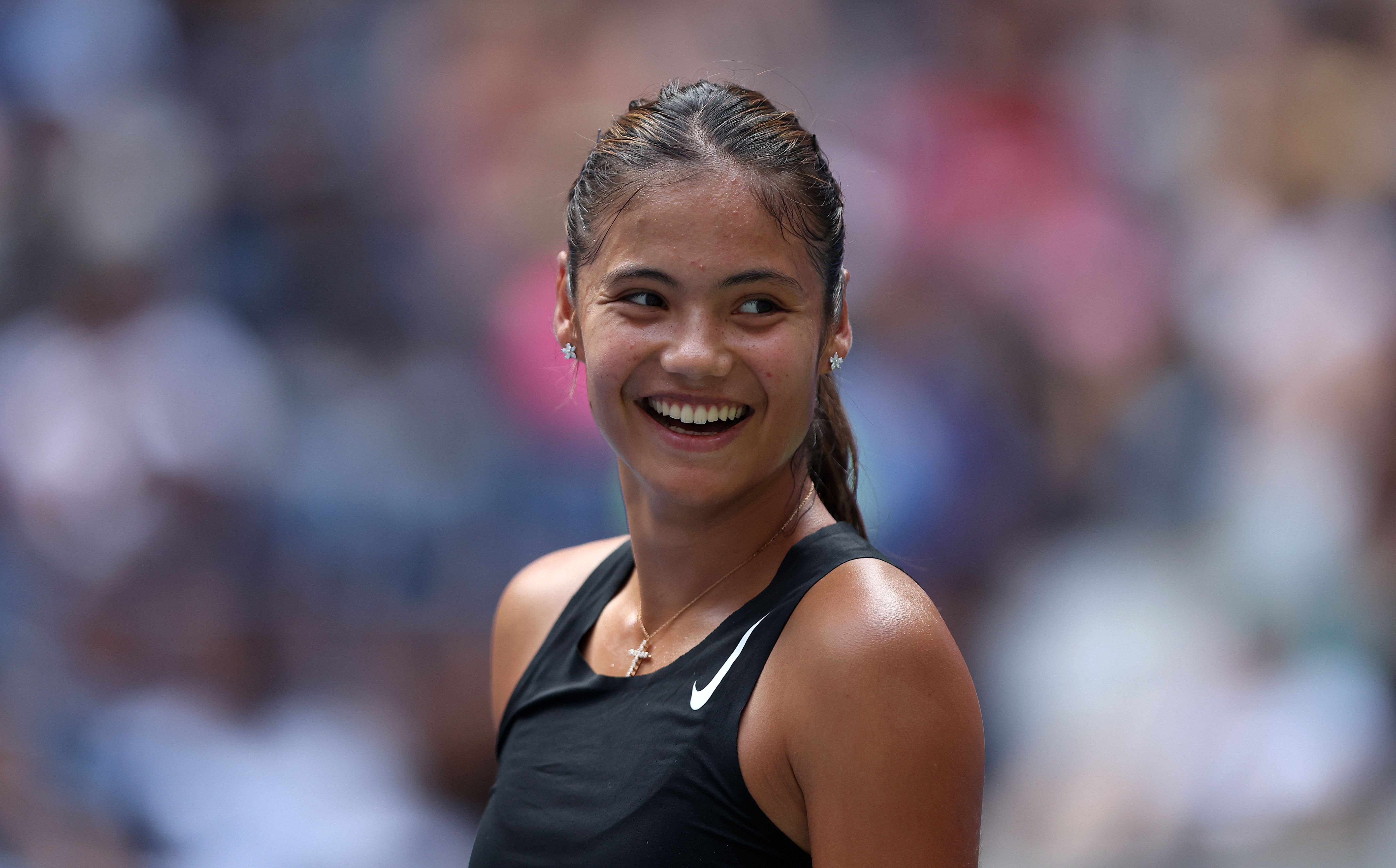 Emma Raducanu smiles during US Open previews