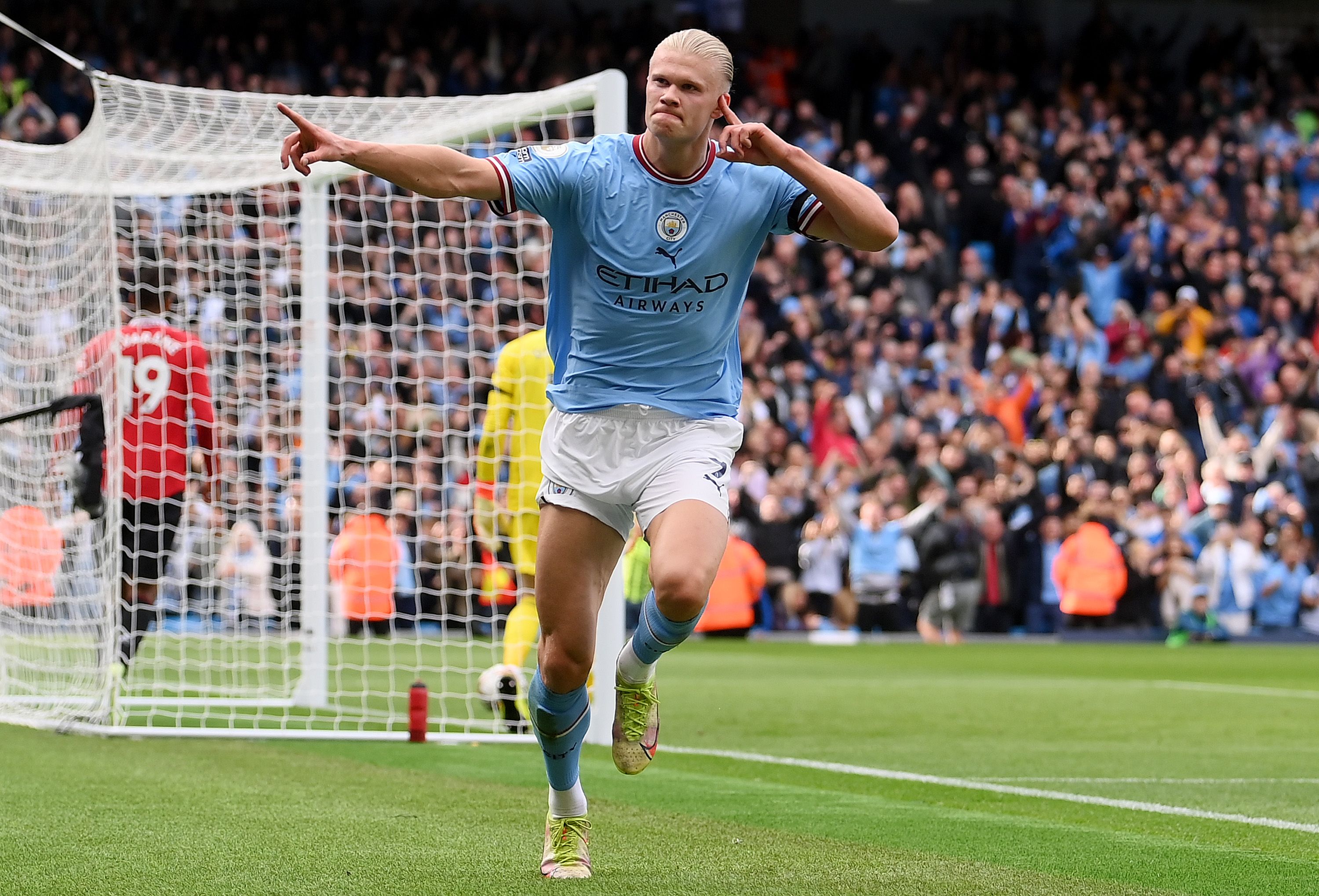 Erling Haaland celebrates scoring in the Manchester derby