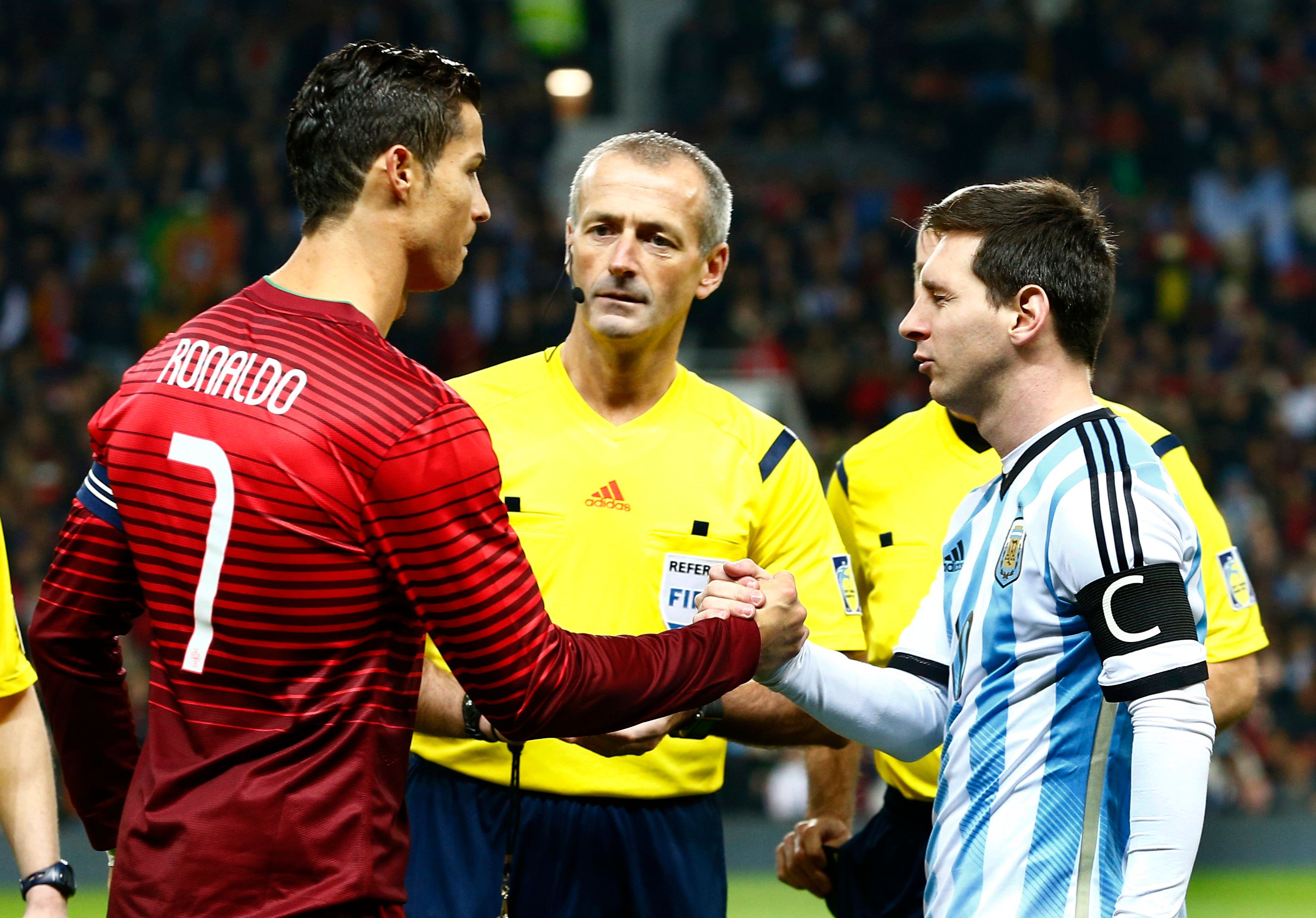 Ronaldo and Messi shake hands before an international friendly.