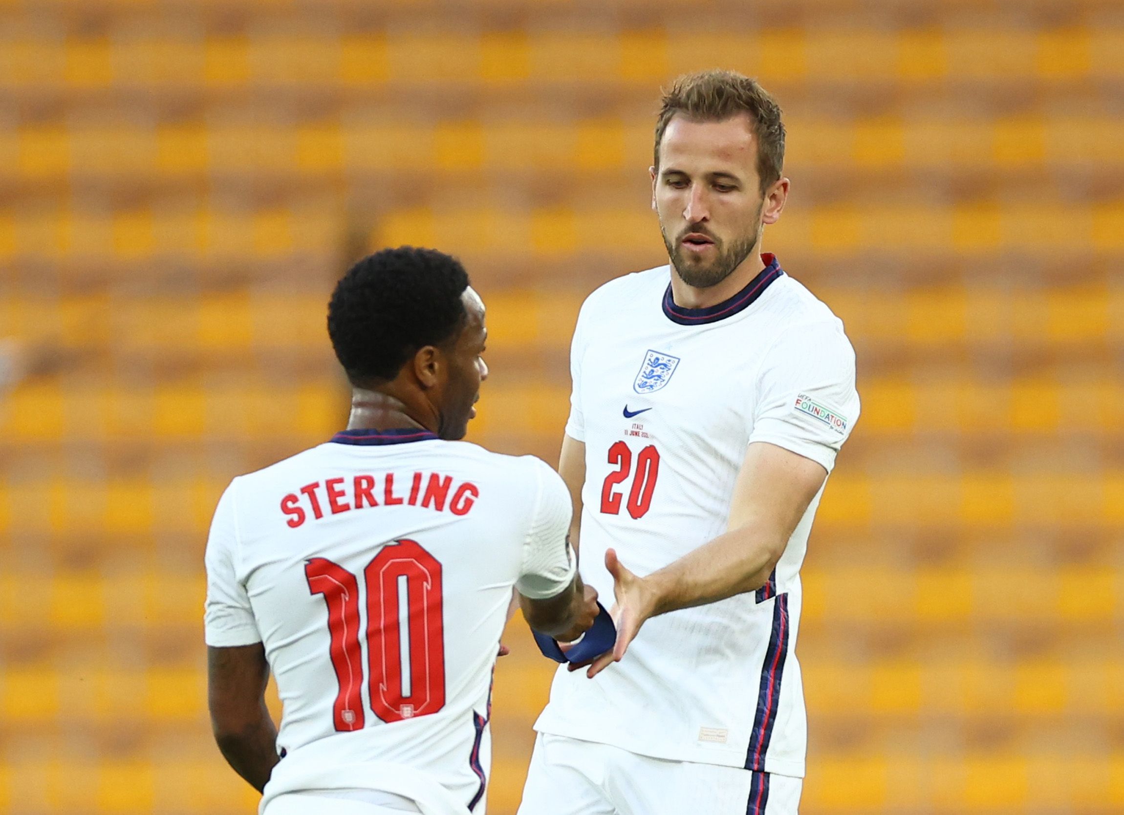 Sterling passes the England captain's armband to Kane.